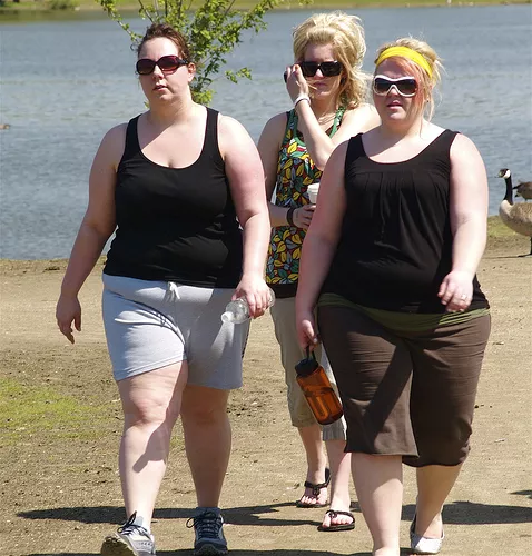 3 ladies hot, sweaty, and exhausted after only walking to the trash can to throw away theirs cups!