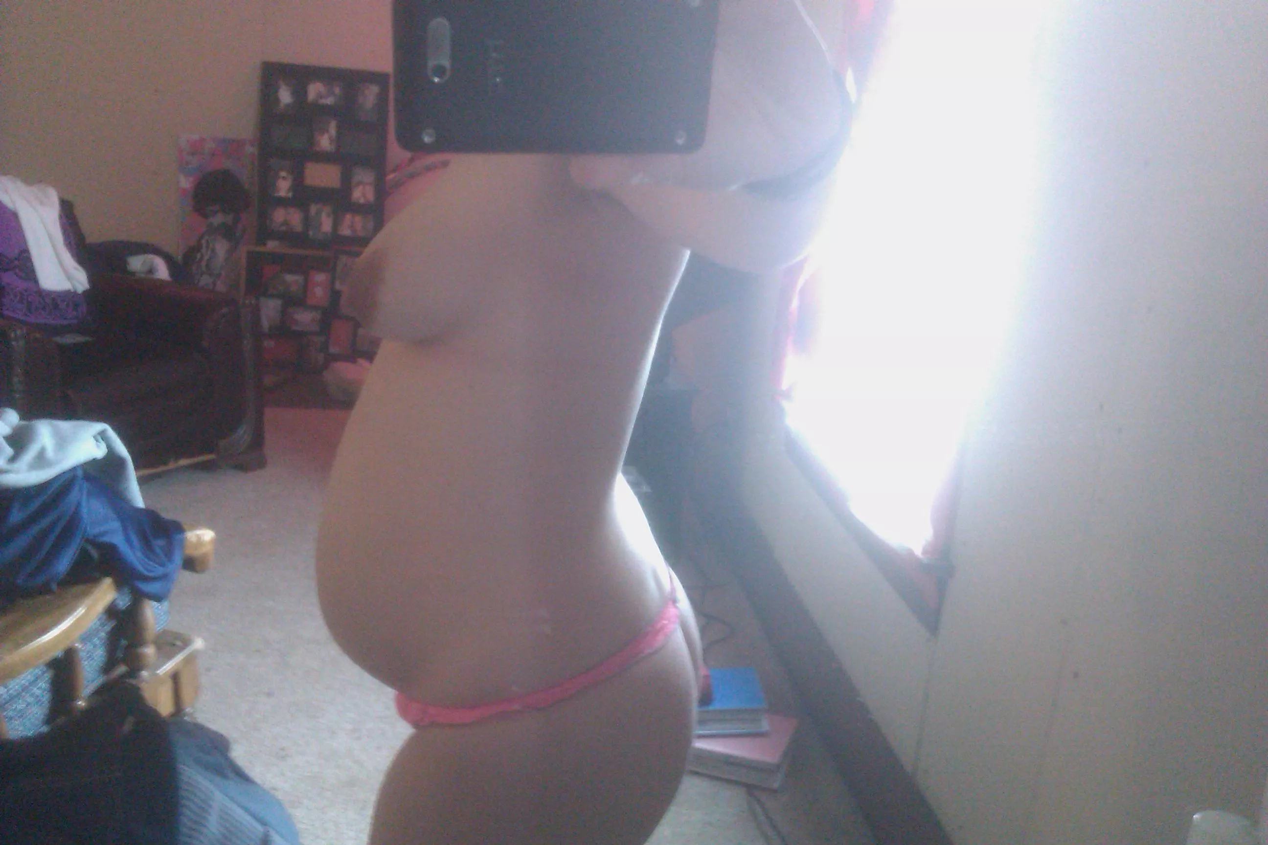 A pregnant bump in panties