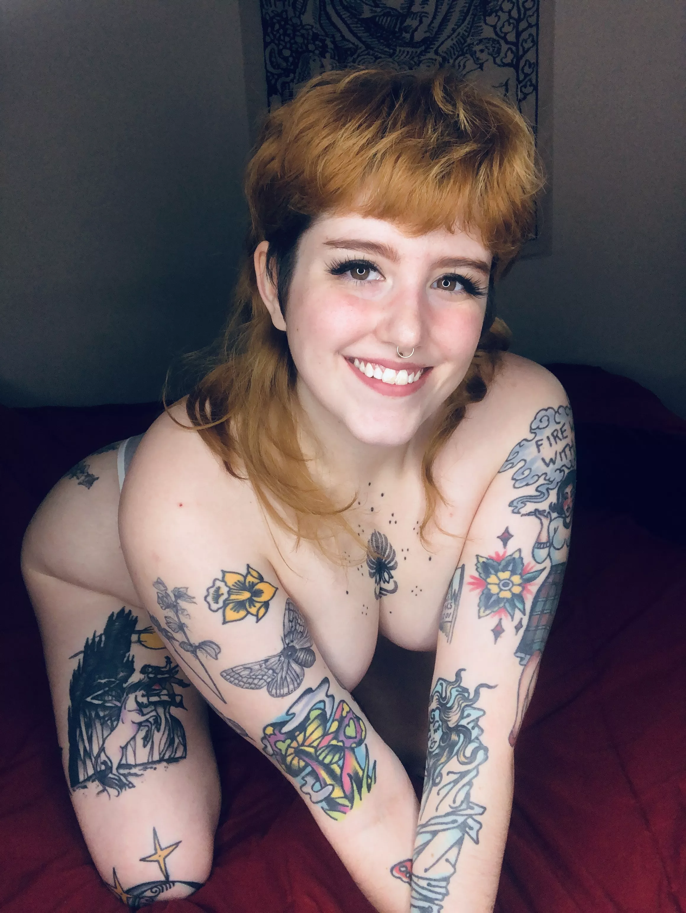 A wild tatted redhead