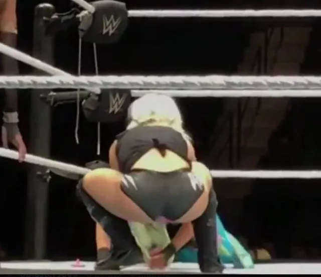 Alexa Bliss squatting with her biscuit booty!