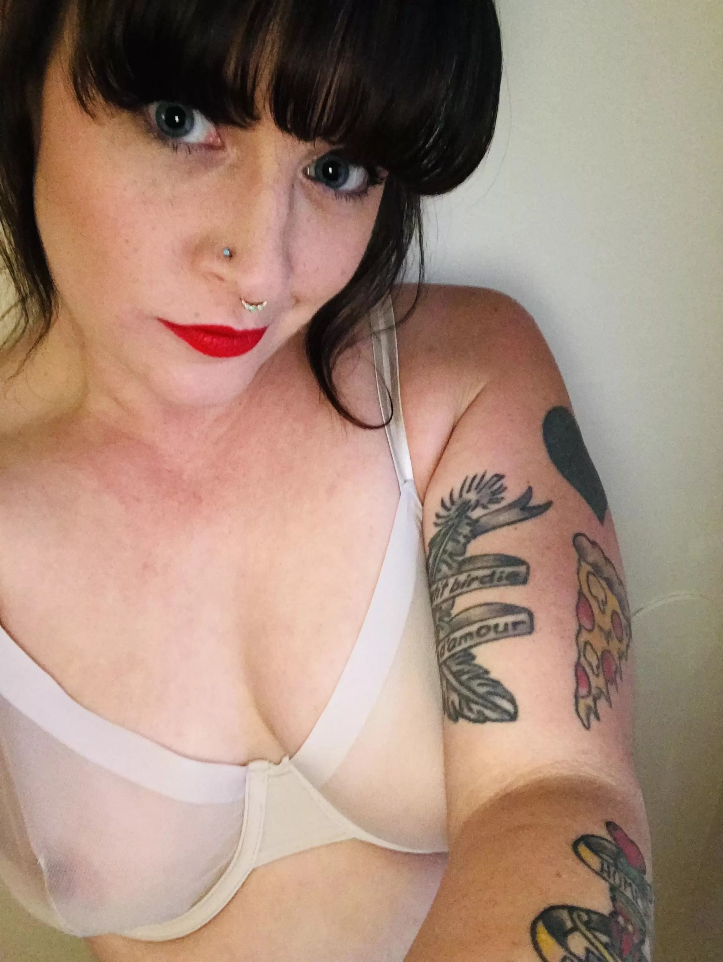 Always cute… red lips, winged liner, and nipple action….