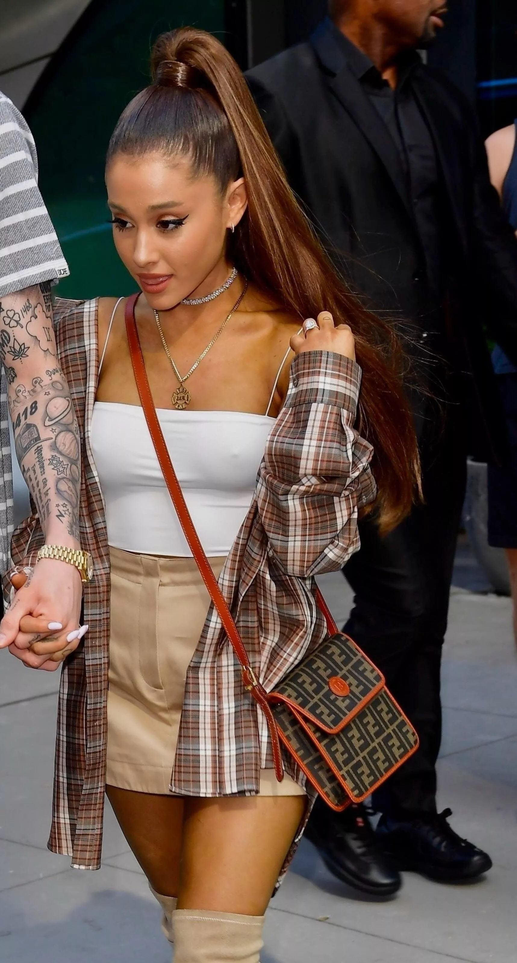 Ariana Grande pokies in a see-through top