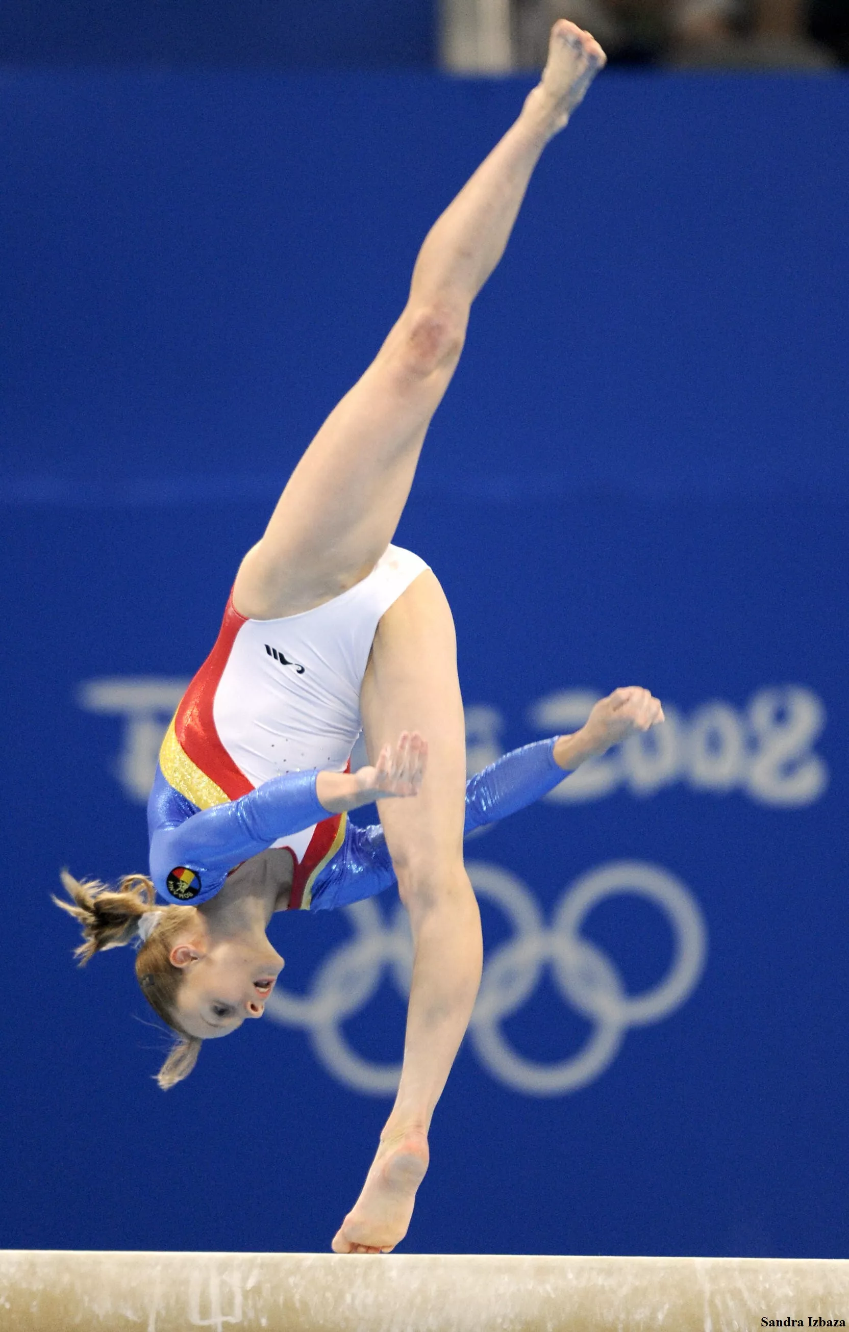 Artistic woman gymnast Sandra Izbasa on balance beam during 2008 olympics