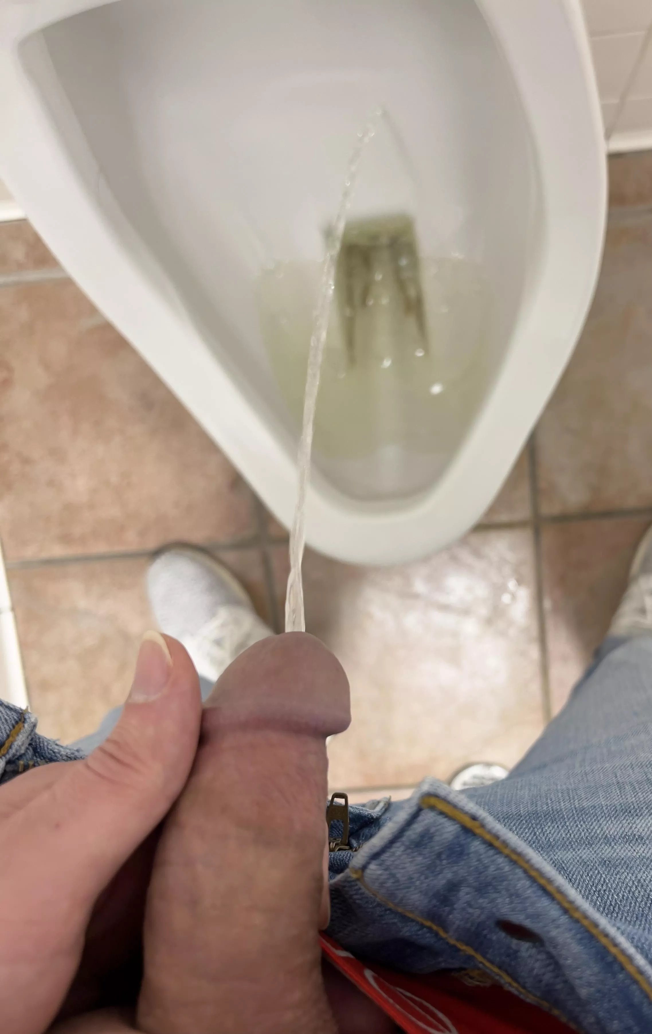 At the urinal