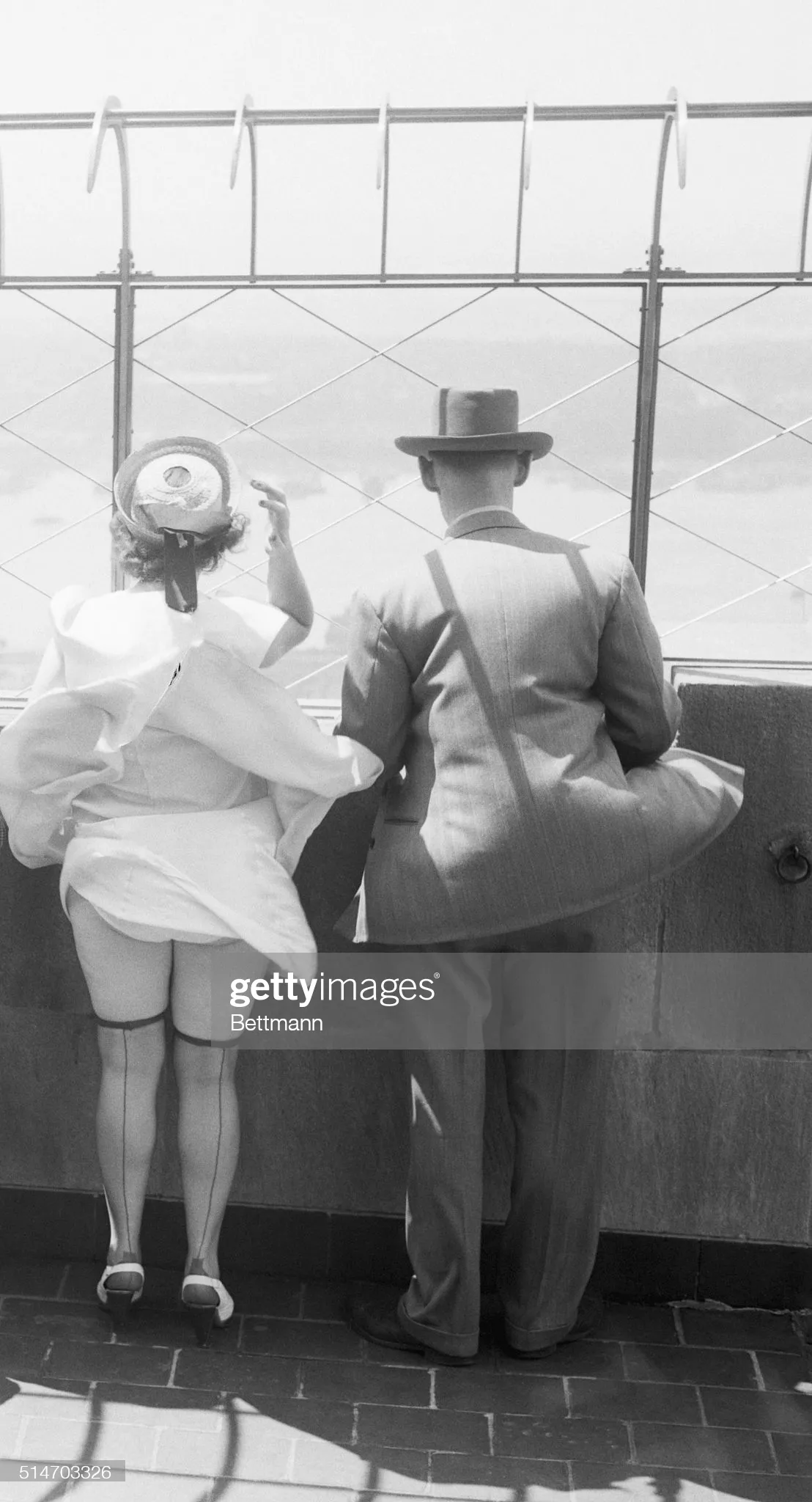 Bit windy on top of the Empire State Building (1954).