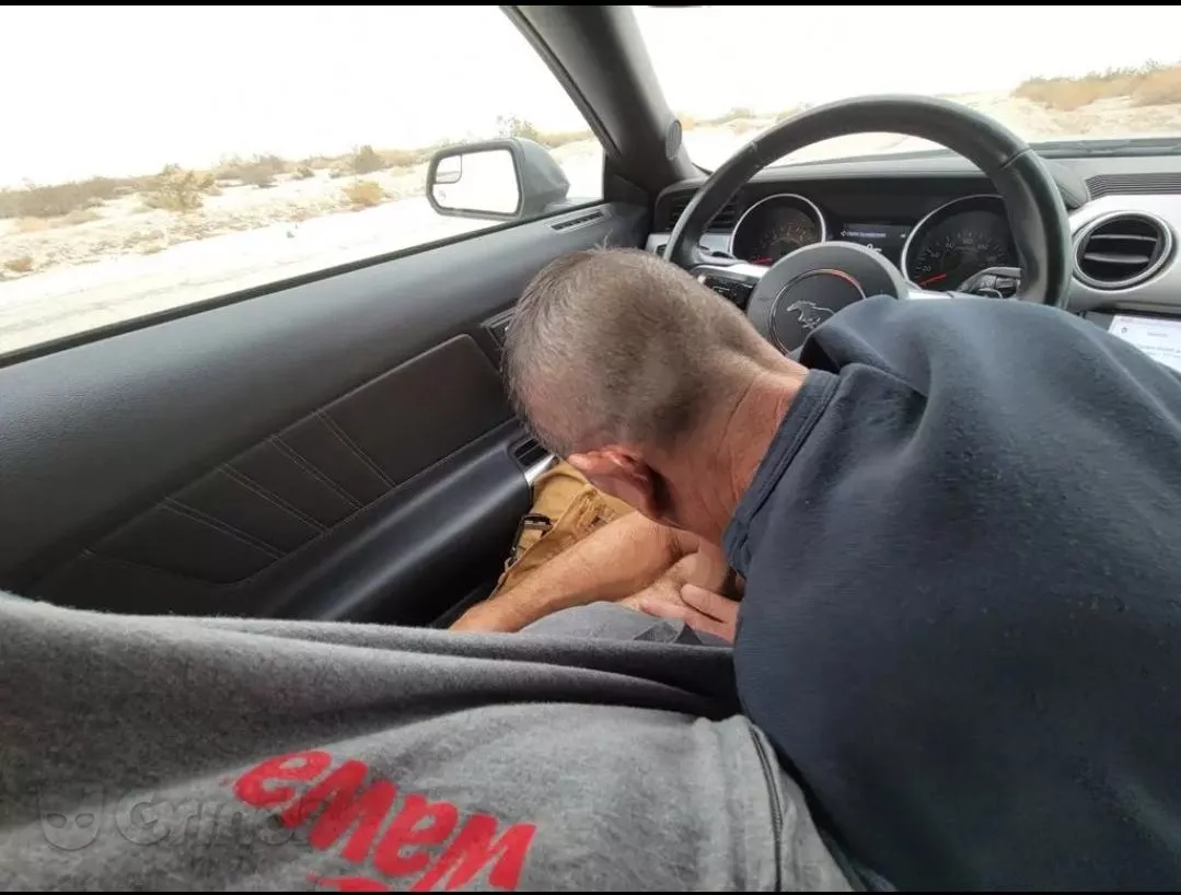 Blowjob in rental car pulled over on the side of a desert road during a dust storm