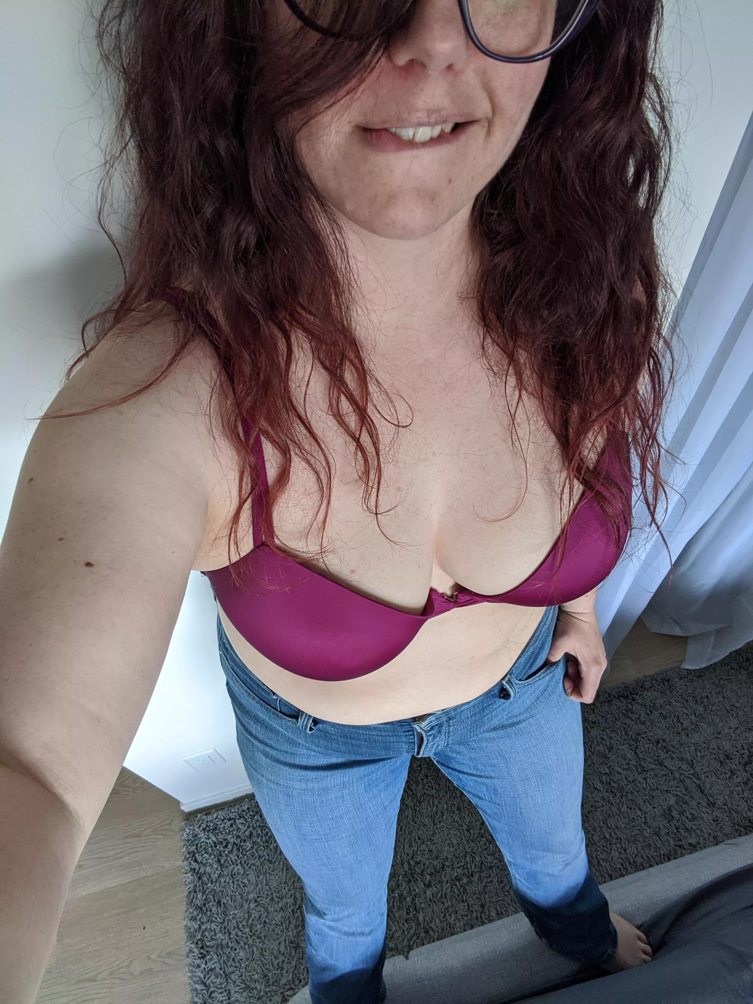 Blue jeans and fuschia boobs.