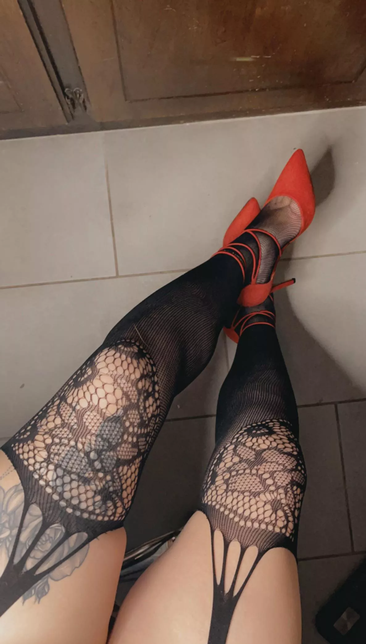 Canâ€™t go wrong with fishnets and red heels