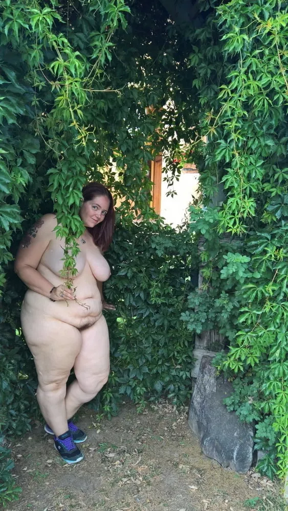 Chubby nudie hiding in a bush