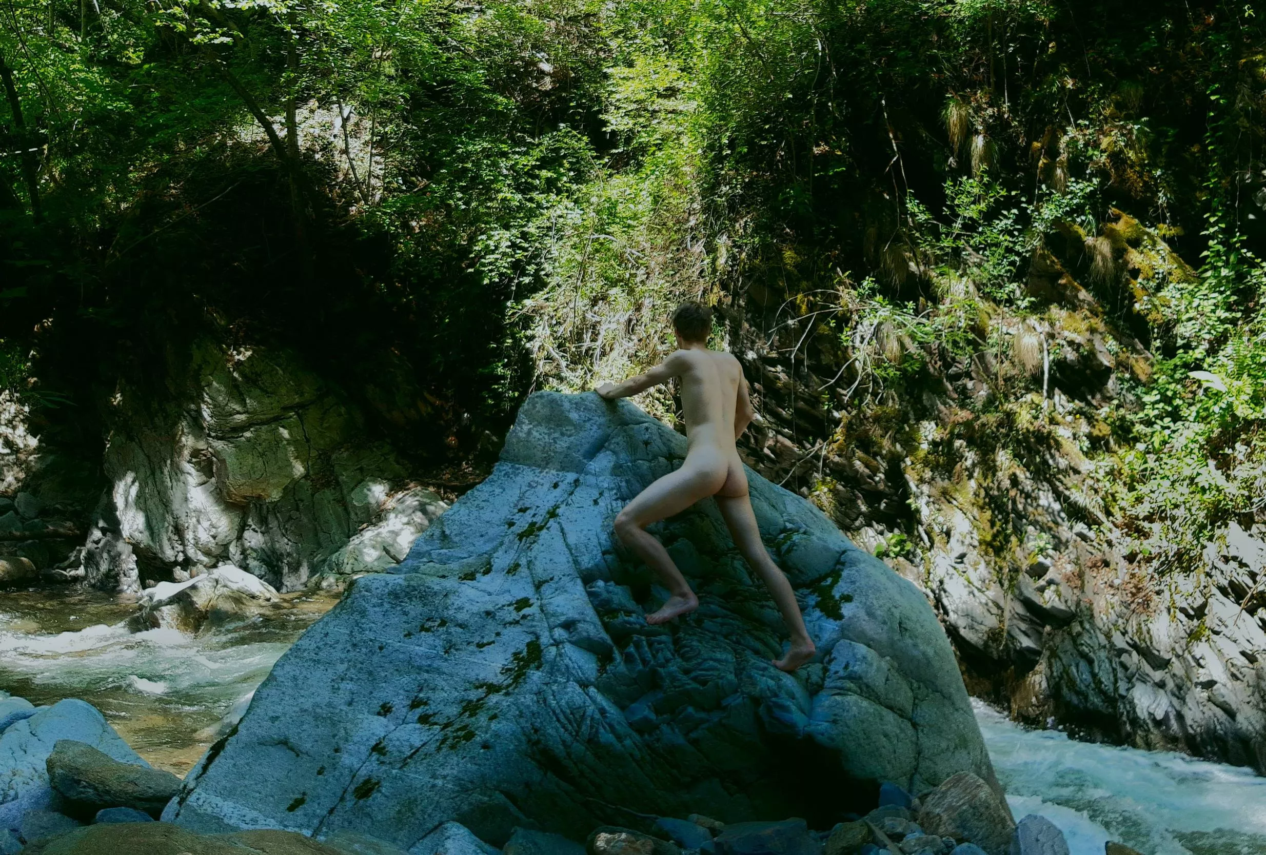 Climbing a boulder I found during a hike