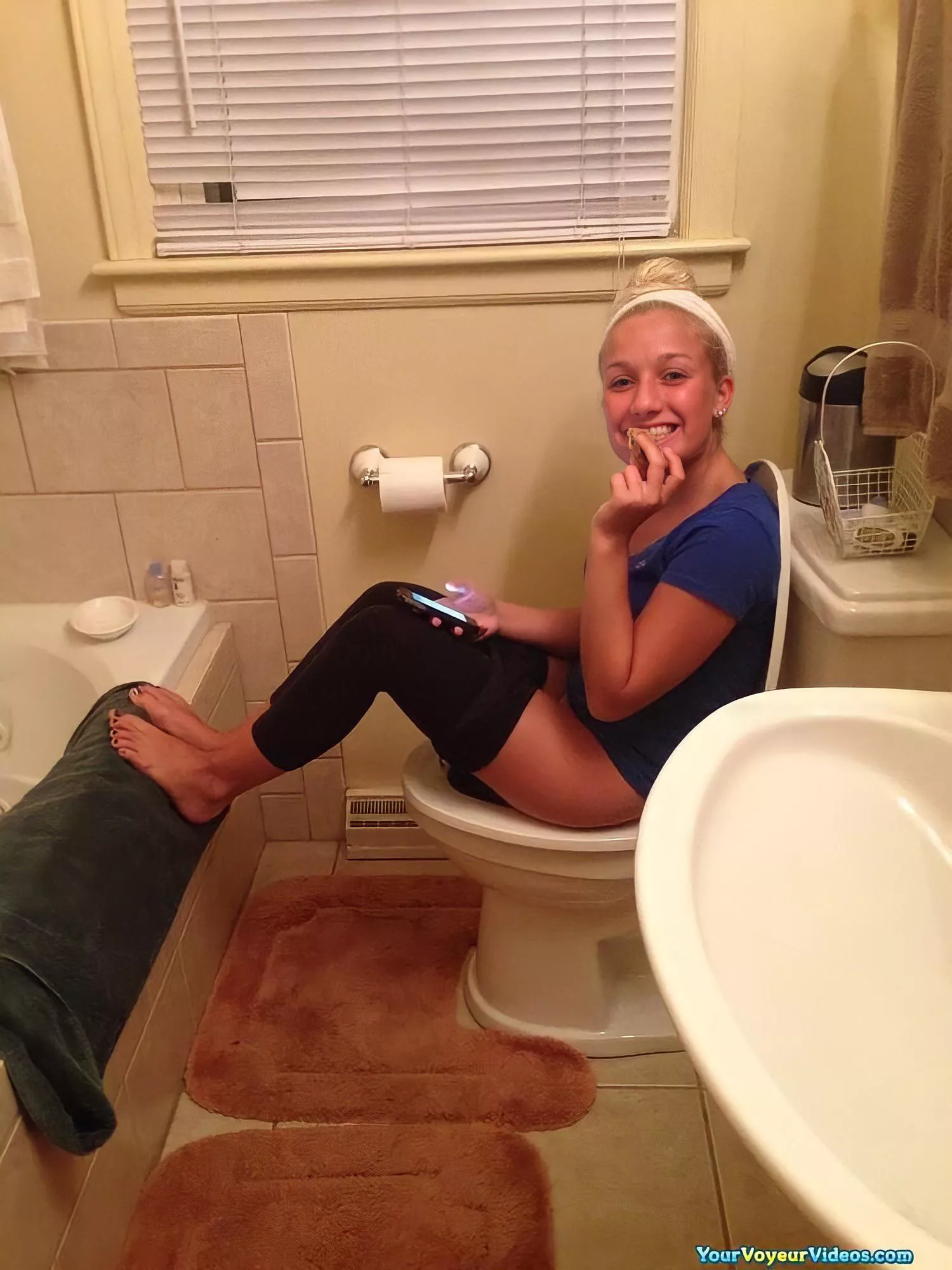 cute girl caught lounging on the toilet