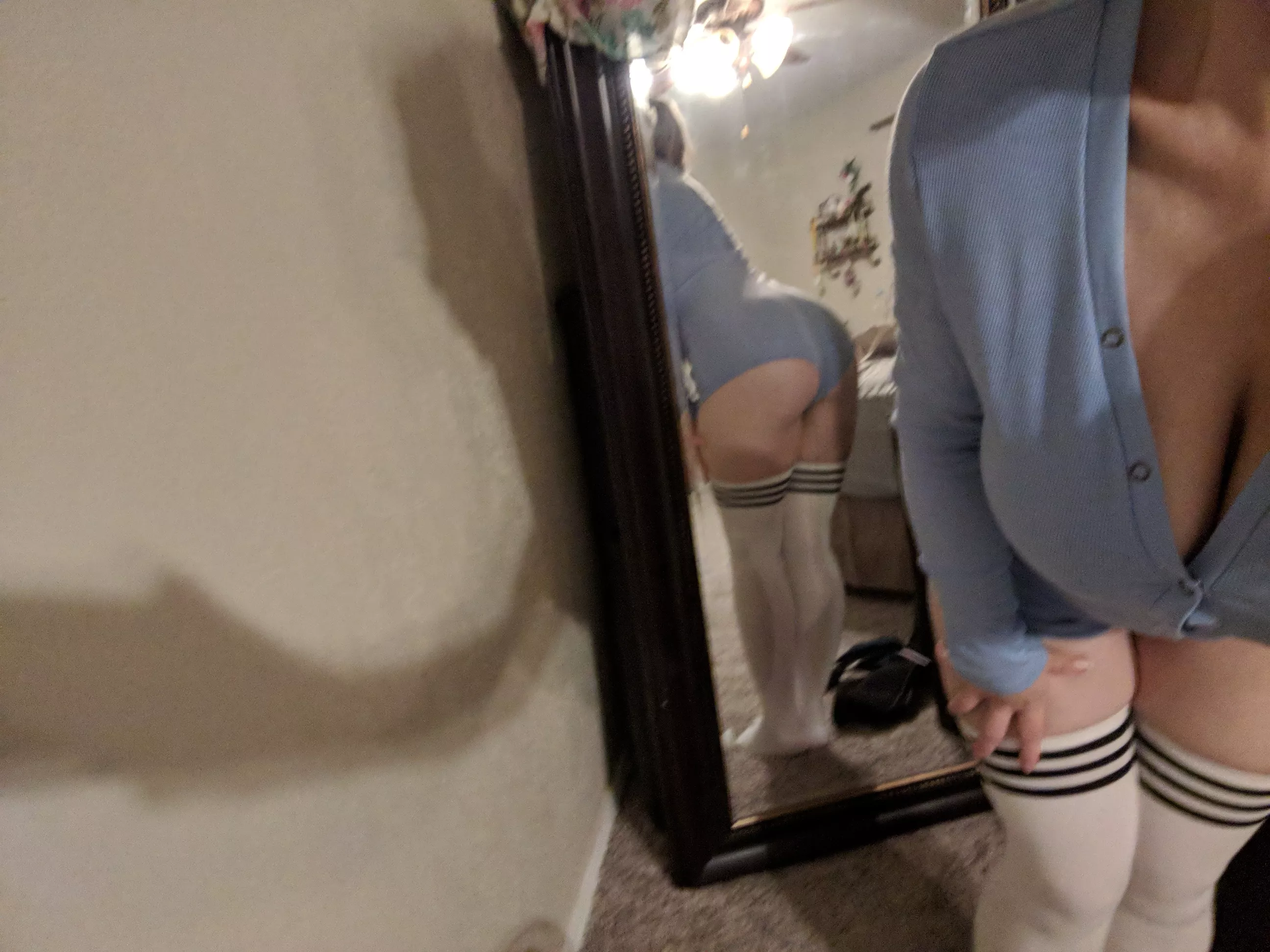 Do you prefer the front or back view of this blue onesie and high socks?