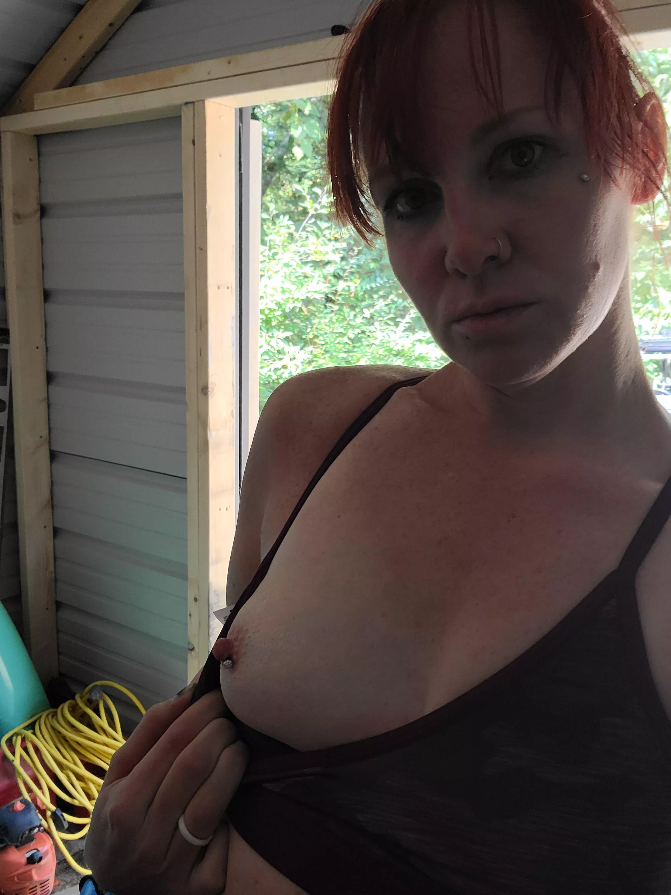 Doing yard work being naughty