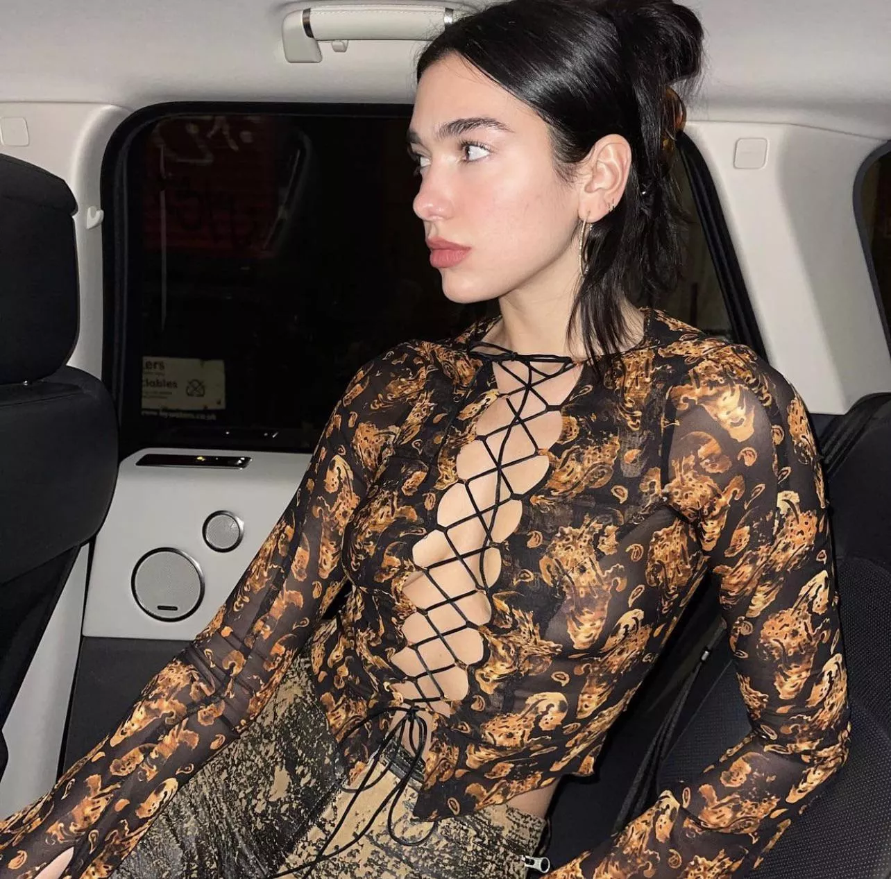 Dua Lipa in a see through top