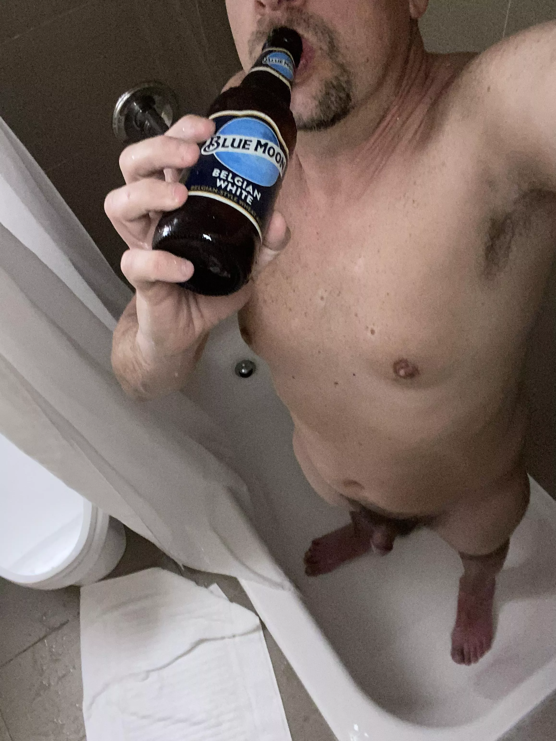 Enjoying a shower beer