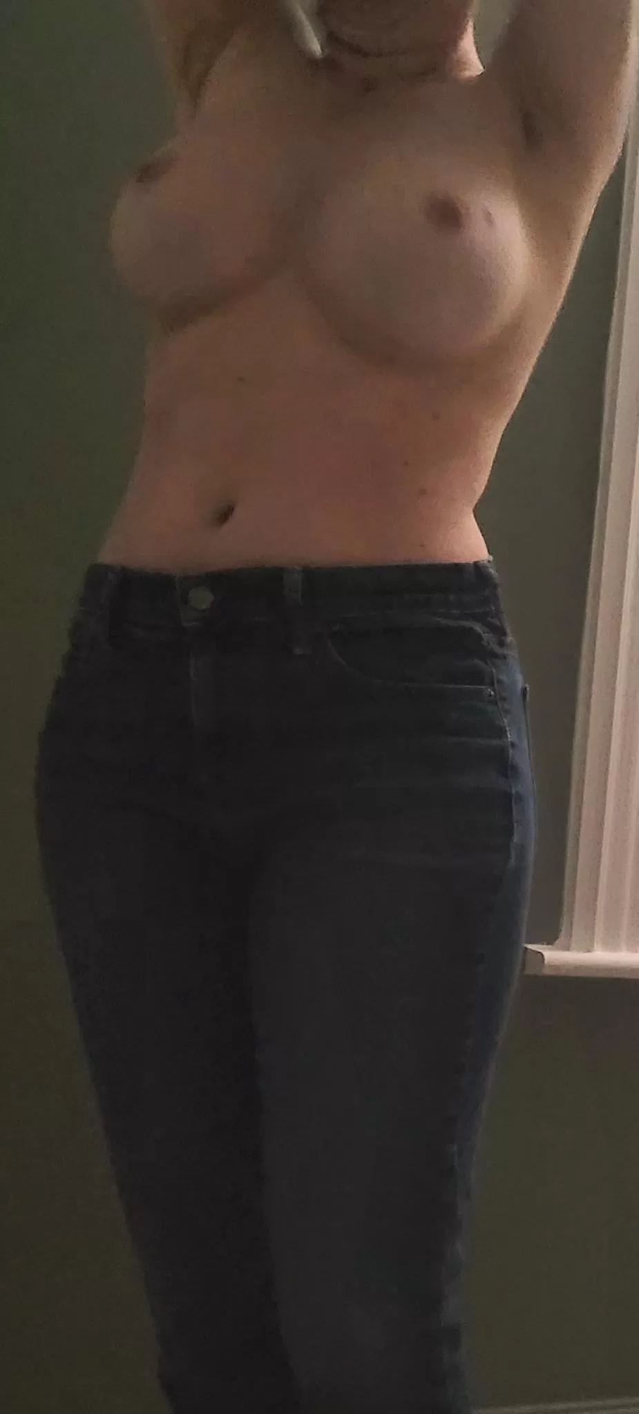 F 42. Topless in jeans.