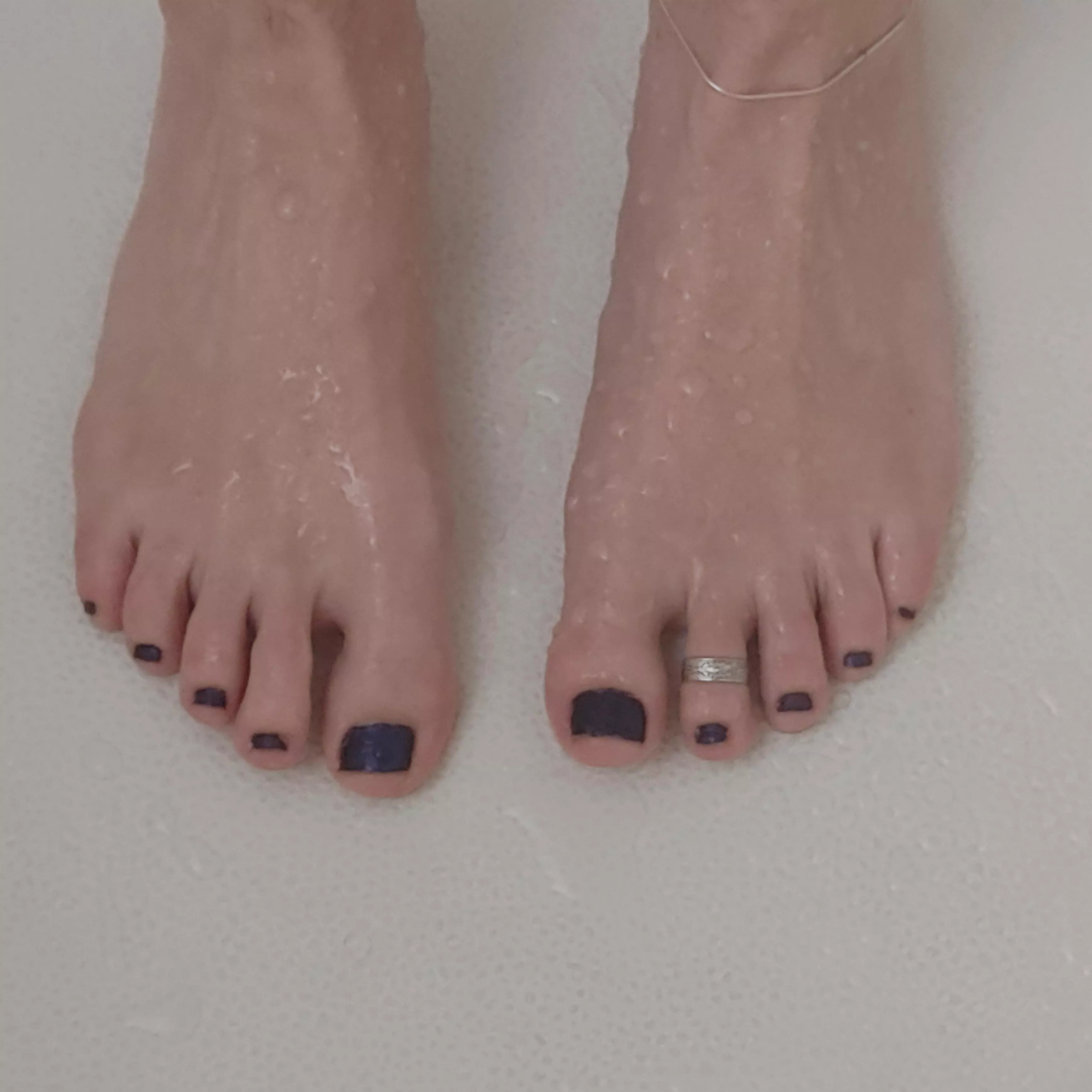 First time here! Cleaning my tootsies in the shower! Painted my nails this spooky purple color for All Hallows Eve.