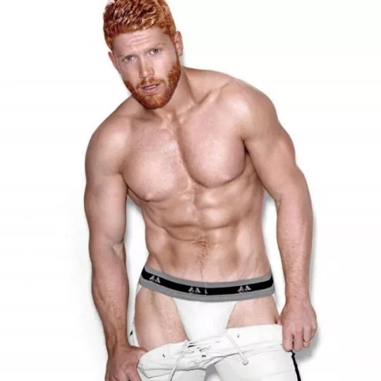 Ginger taking off his pants