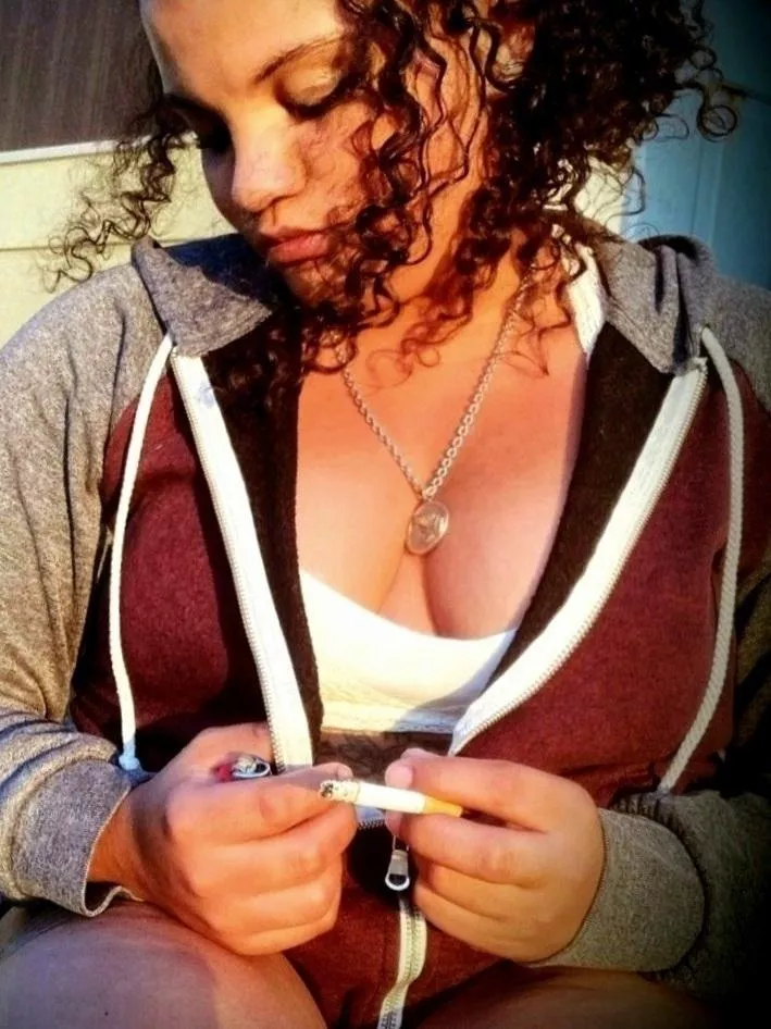 Gorgeous girl on the porch smoking