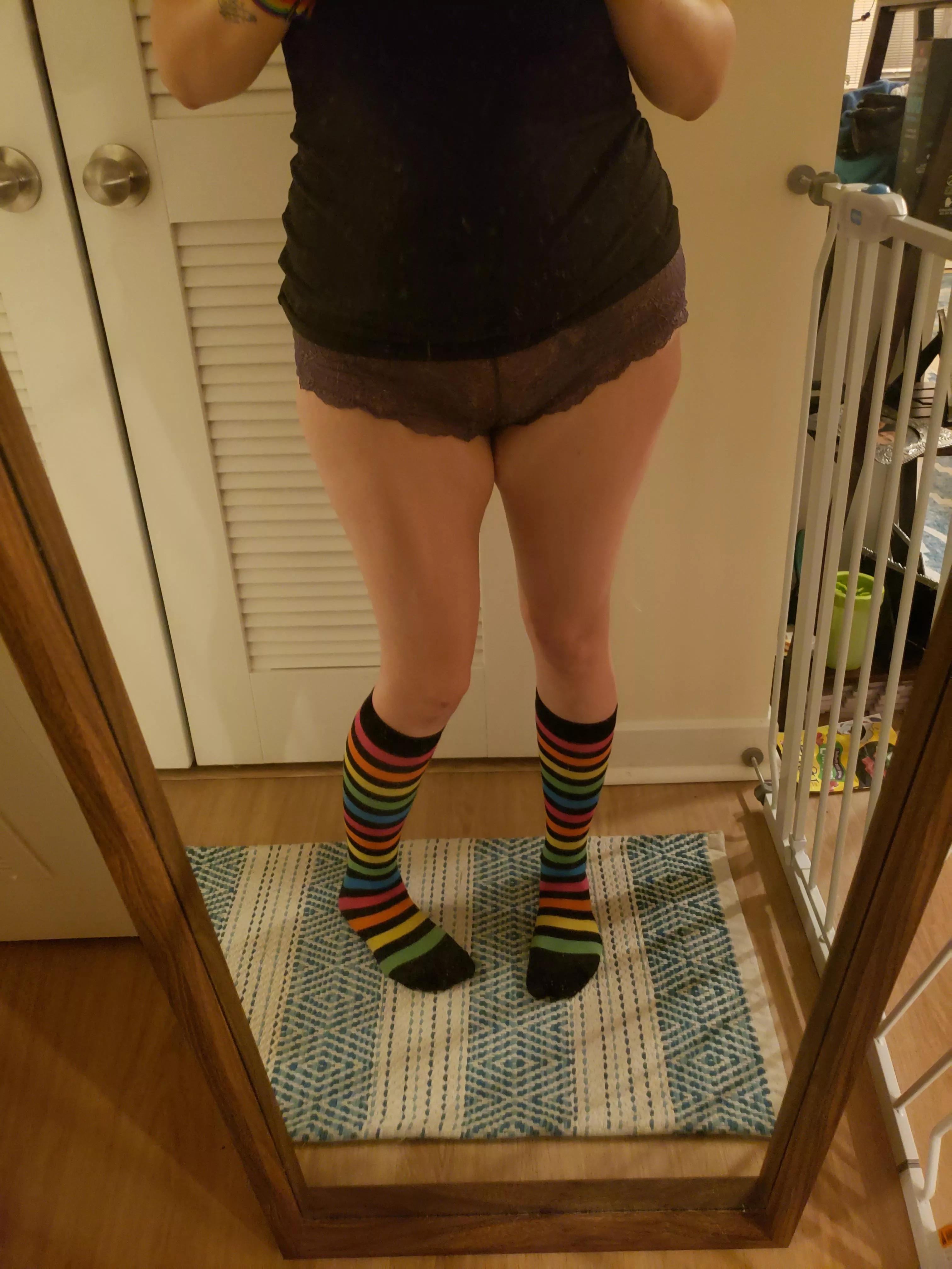 Grey wearing her favorite pair of rainbow socks