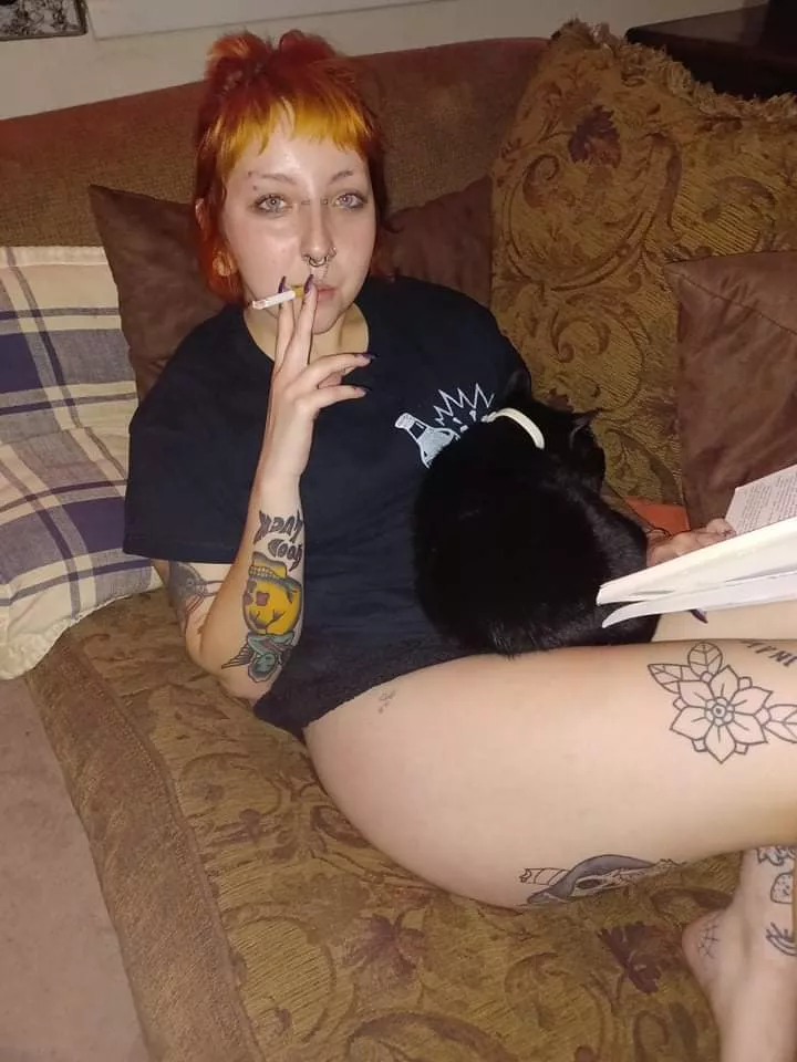 Having a cigarette on the couch with my book and cat! Any book recommendations?:)