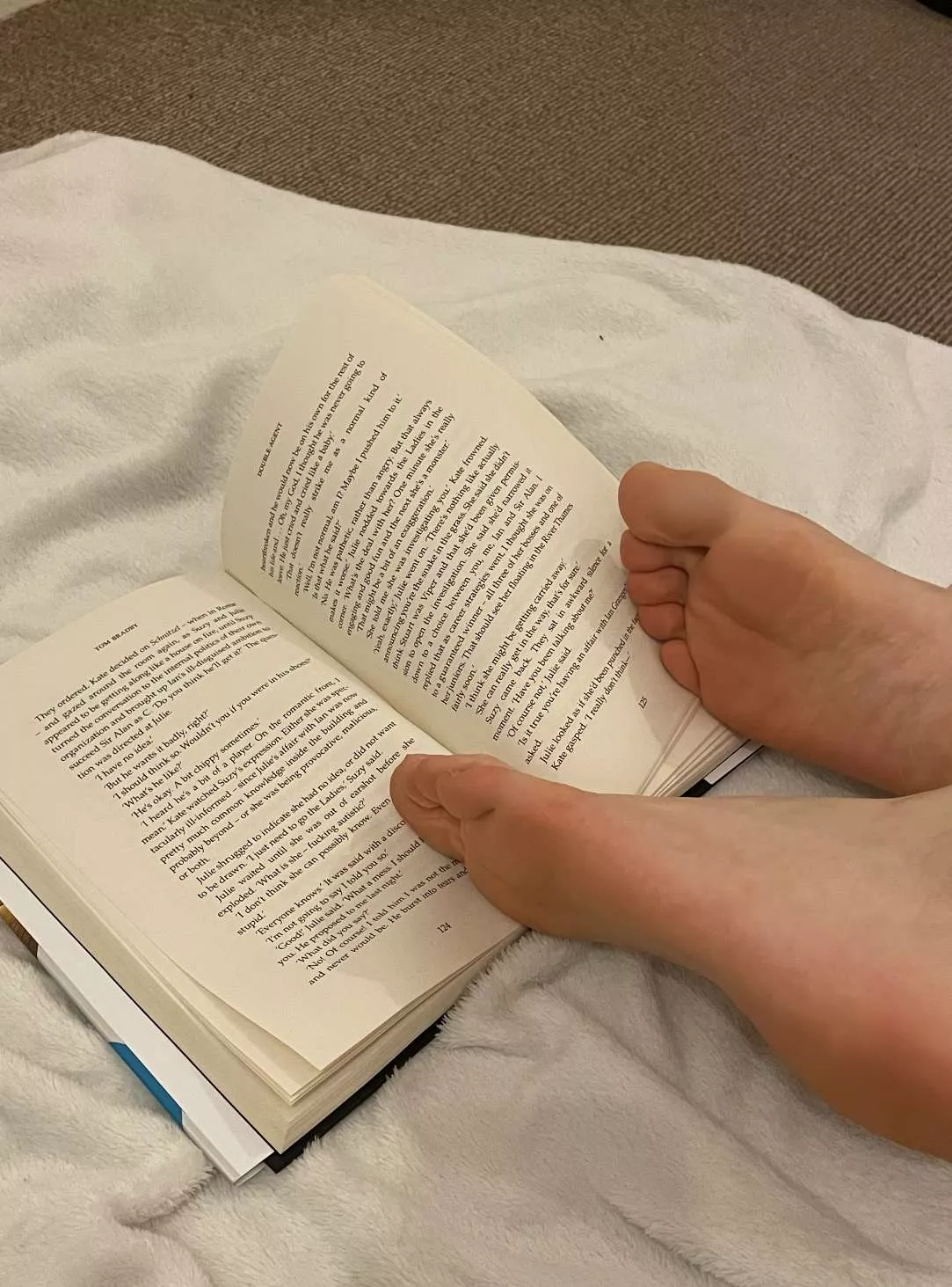 Having a read. Come nibble my feet whilst I relax. Tell me what you would do to me xx