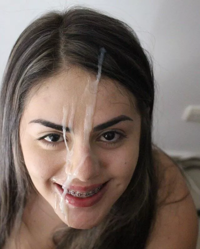 Her braces makes the cum on her face look even better