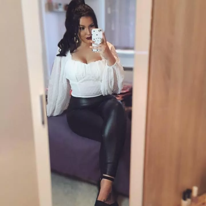 How sexy does she look in shiny leather leggings?