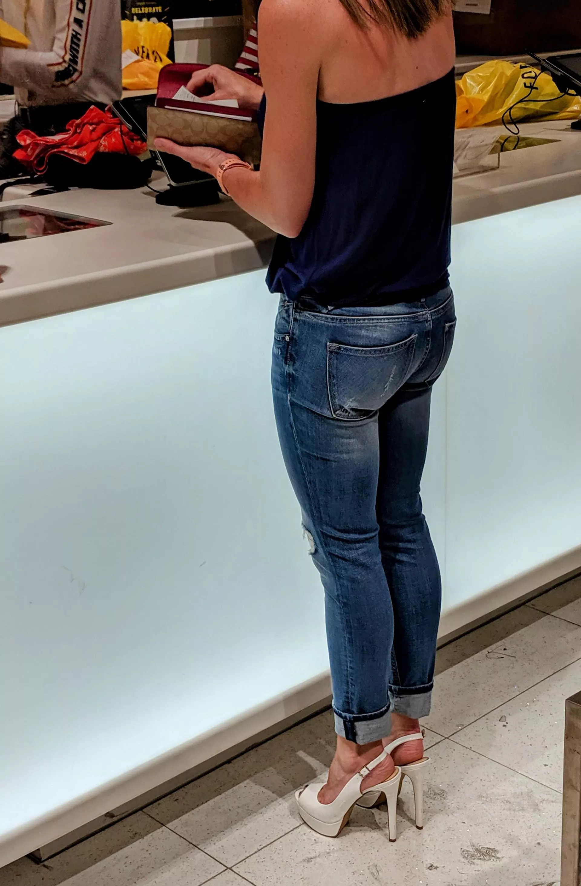 I know it's a boring picture but just thought my wife looked sexy in her tight jeans and high heels.