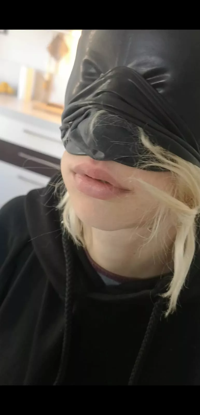 I love this candid photo Sir took of me trying out my new hood. It makes it look like I filled up my lips, which is probably my favorite part of latex hoods