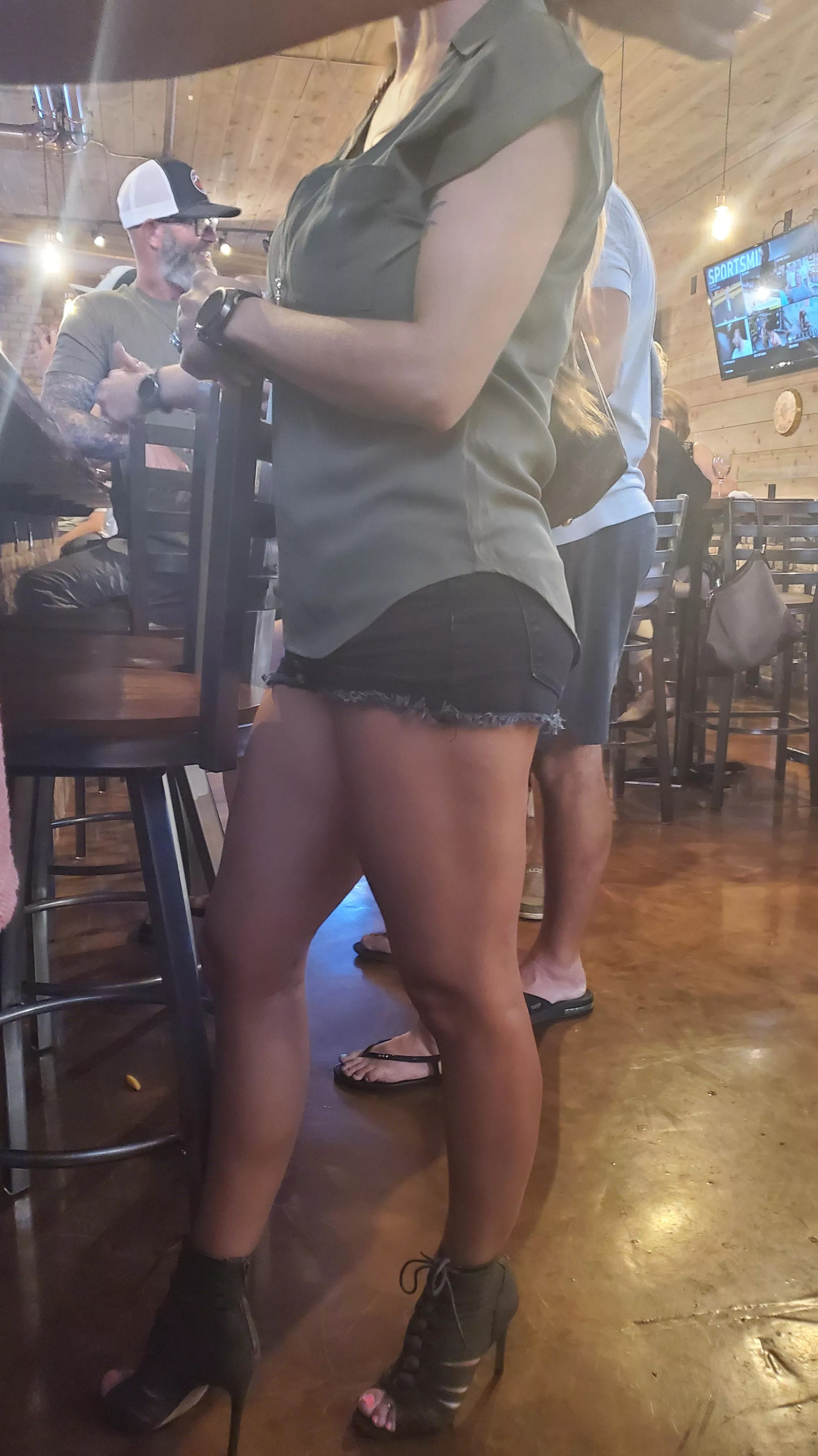 I wear short shorts and heels because I know how much my husband loves it. The fact that he took a picture of me while I was ordering a drink is proof that he does.