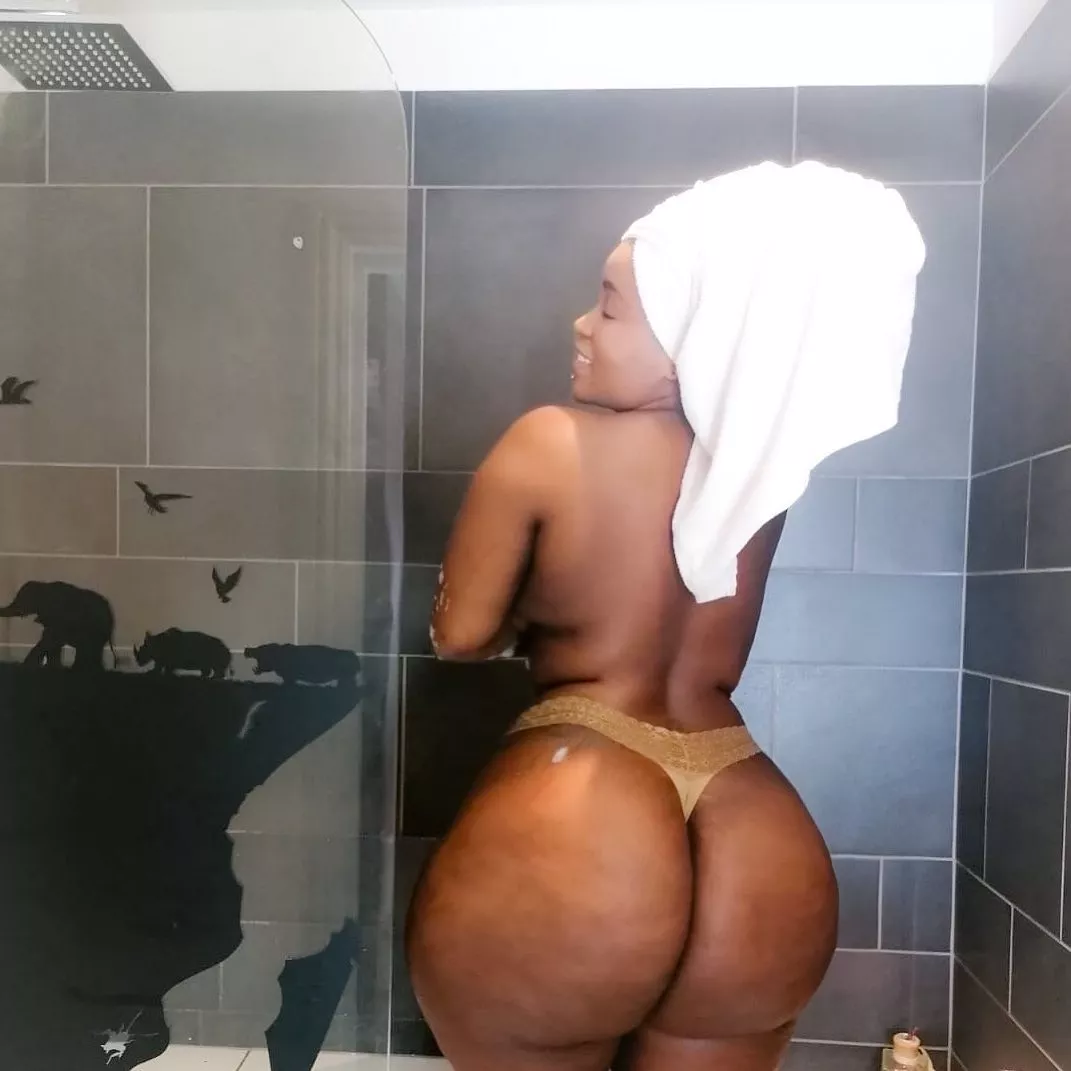 In the shower with a head towel