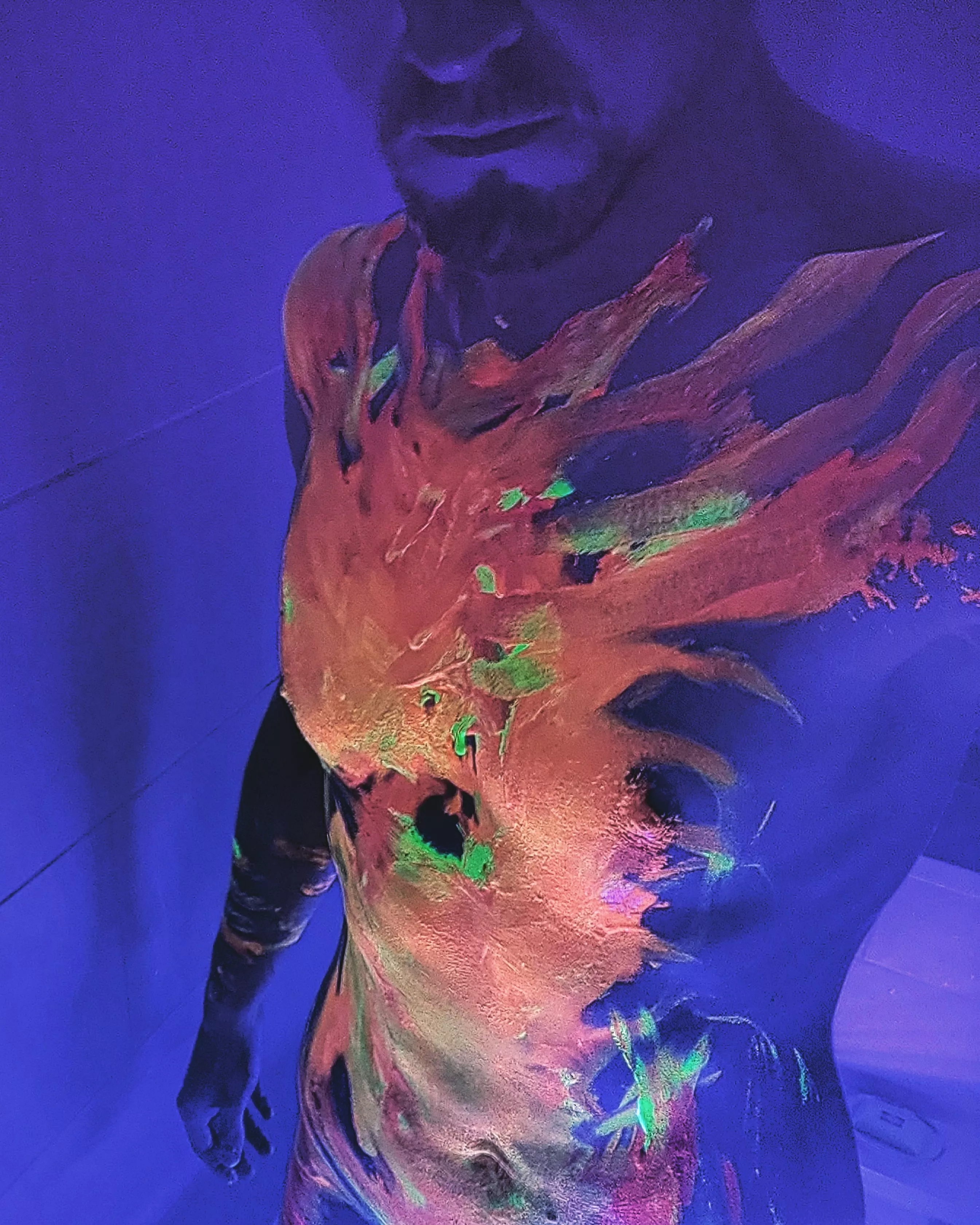 In the UV light whilst covered in body paint