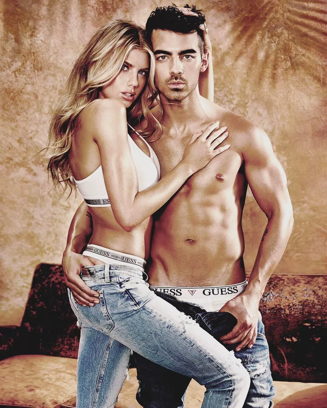 Joe Jonas and Charlotte McKinney Strip for GUESS