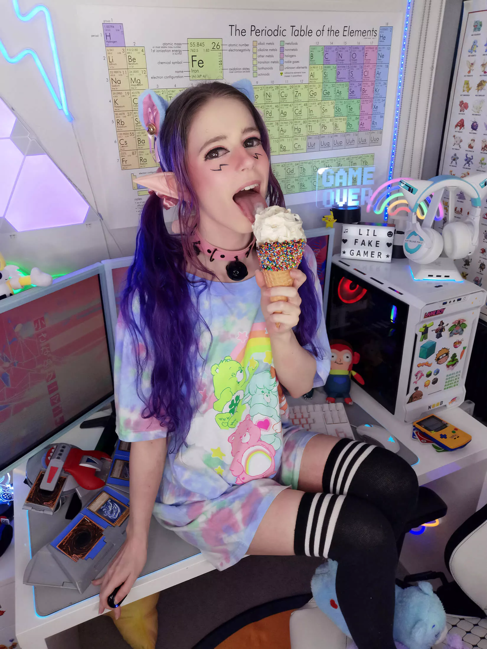 just a lil cutie sitting on a desk licking ice cream ðŸ¦