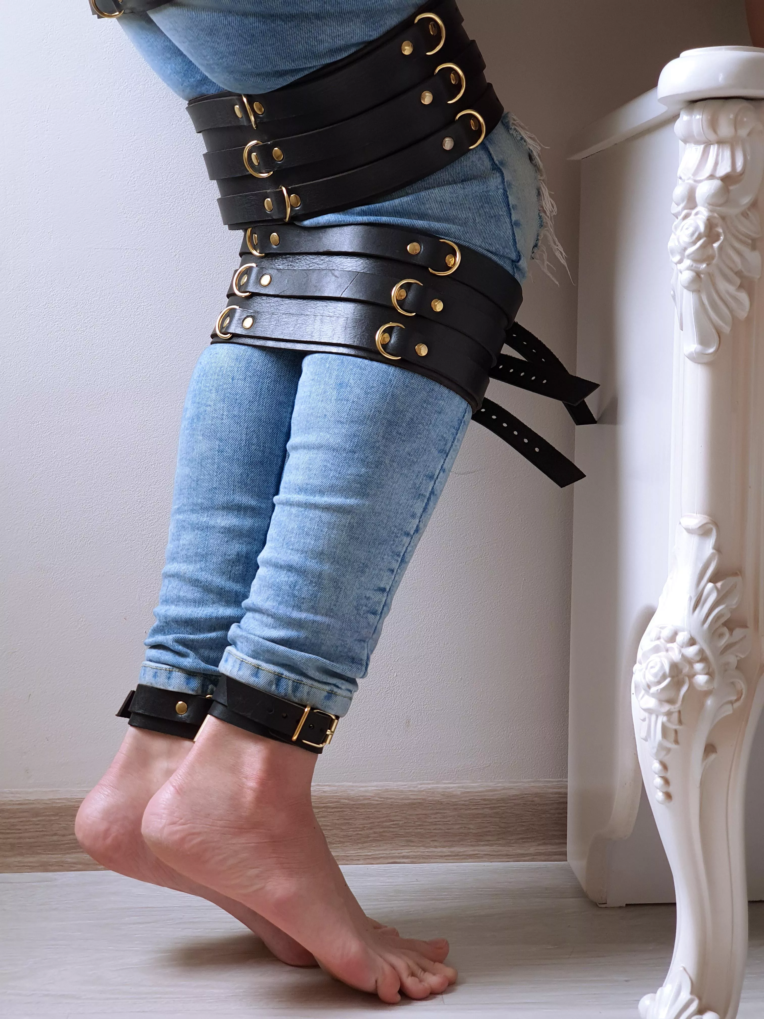 Leather bondage and jeans