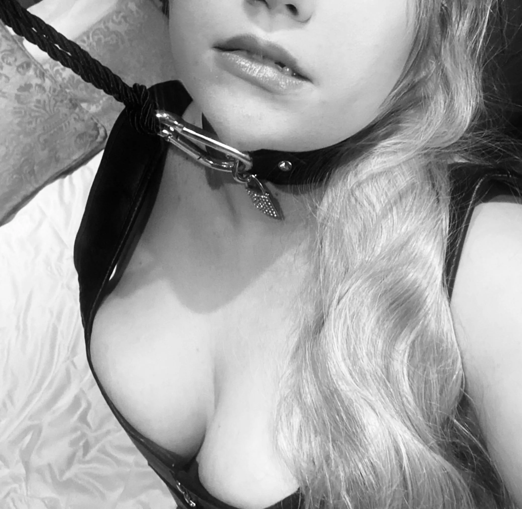 Leather corset, collar and rope leash. What more could a girl ask for?