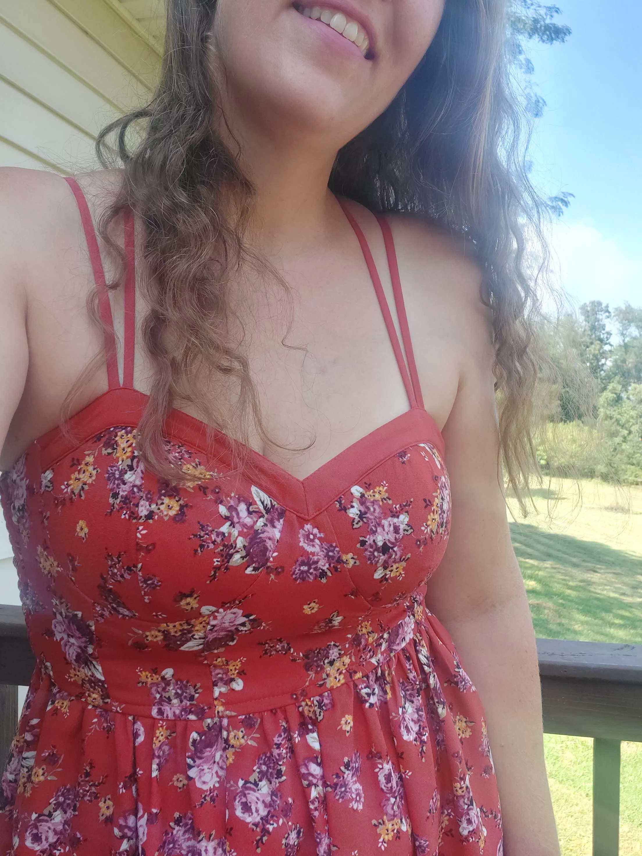 Little red floral sundress and long wind tossed hair. What more can you ask for other than sliding the straps off and slipping it down my body