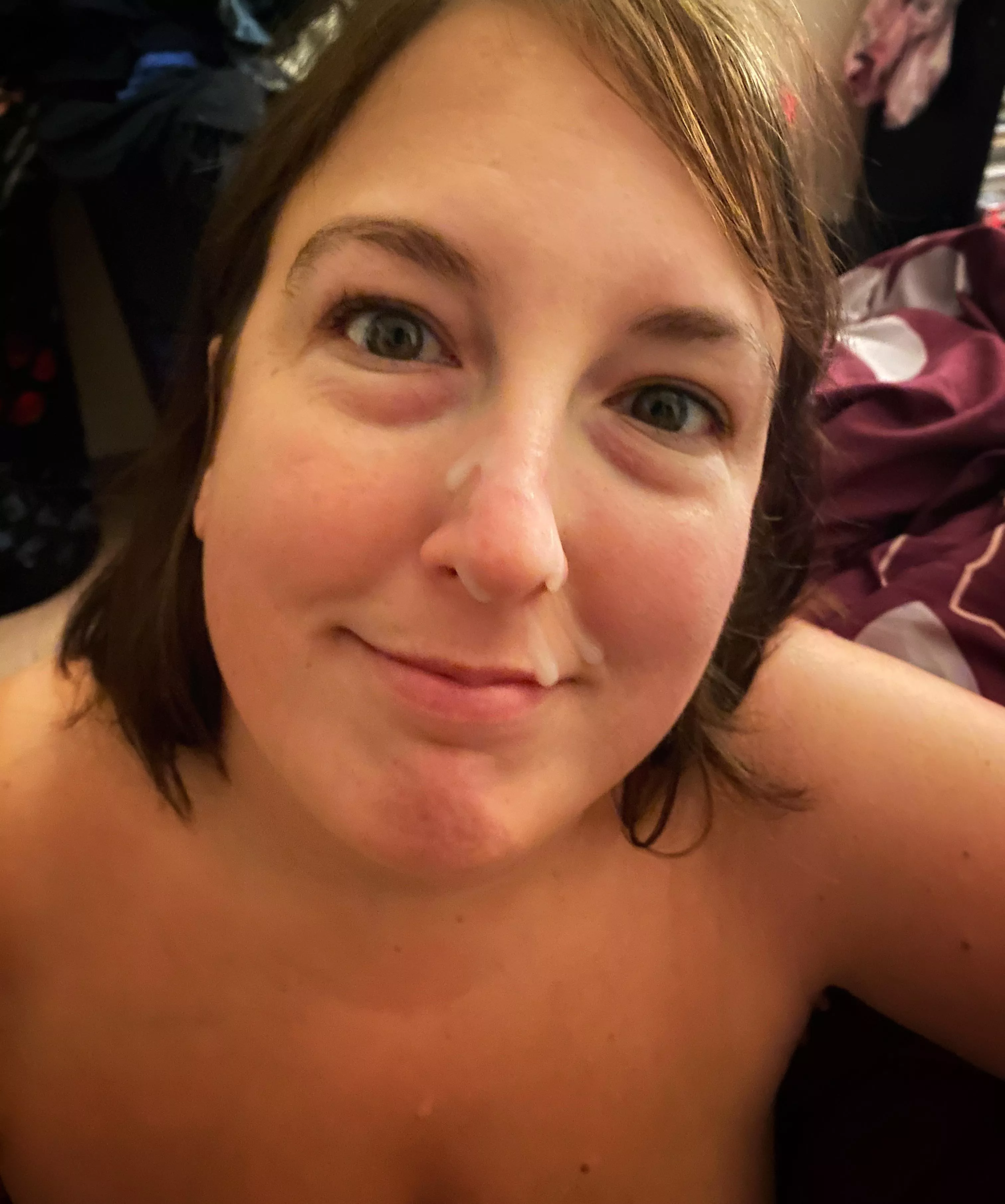 My cum slut smiling with cum on her face.