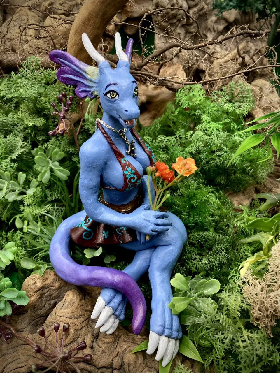 My girl made this amazing sculpture of her OC Raika!