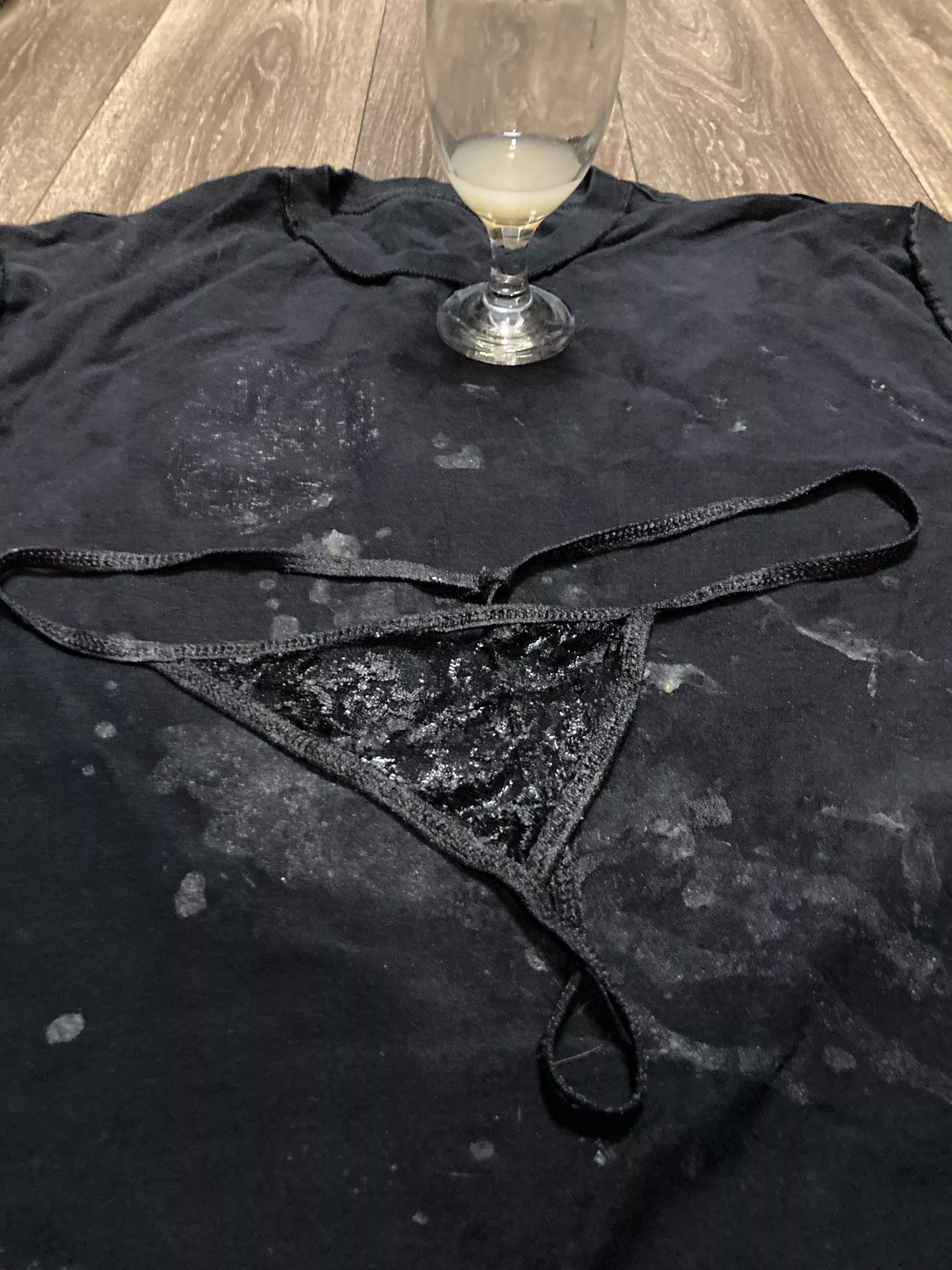 My wife’s black thong panties literally soaked in my cum