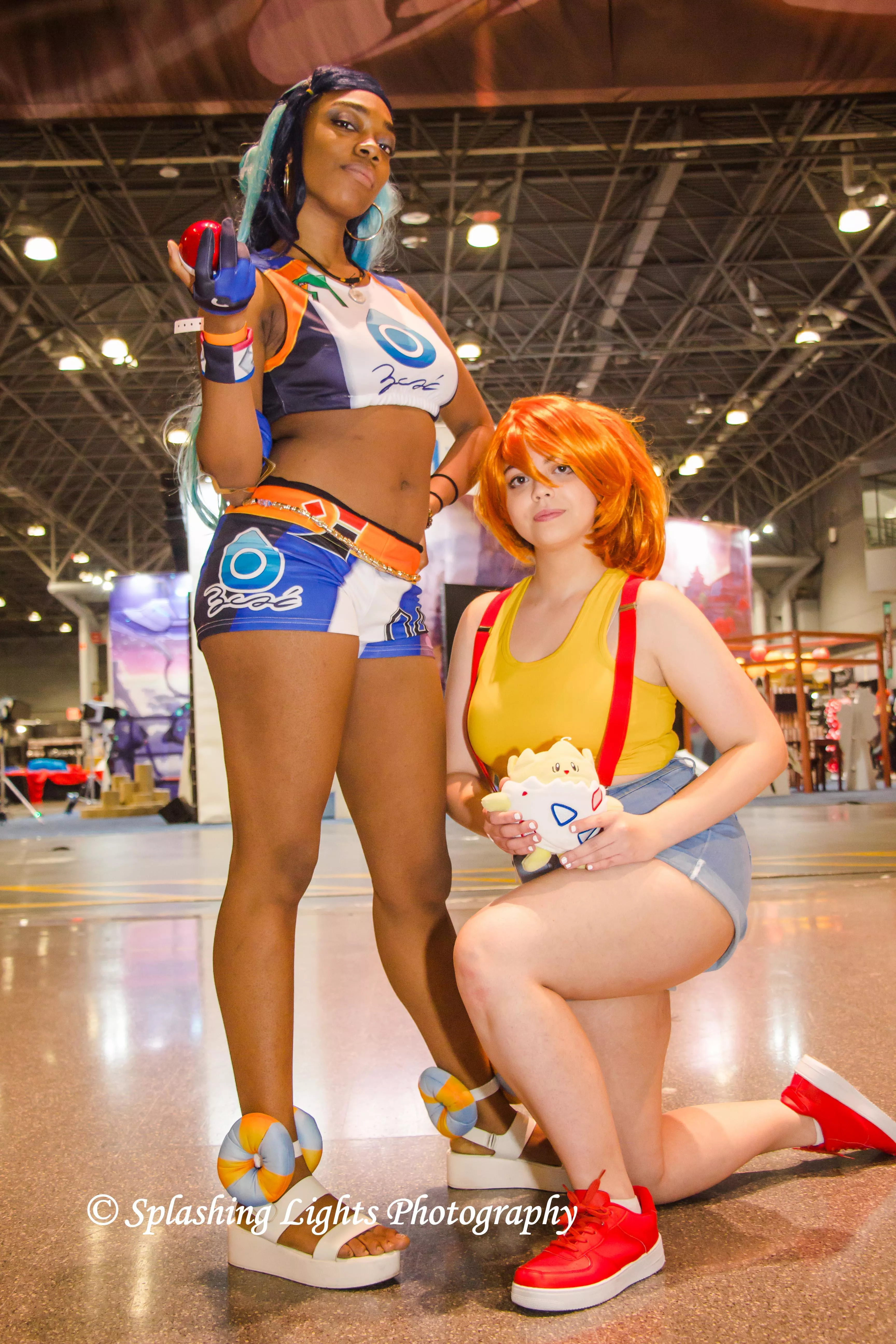 Nessa & Misty from 'Pokemon' at AnimeNYC 2021 portrayed by coserkaze & coserjuju. Photography by Splashing Lights Photography (me)