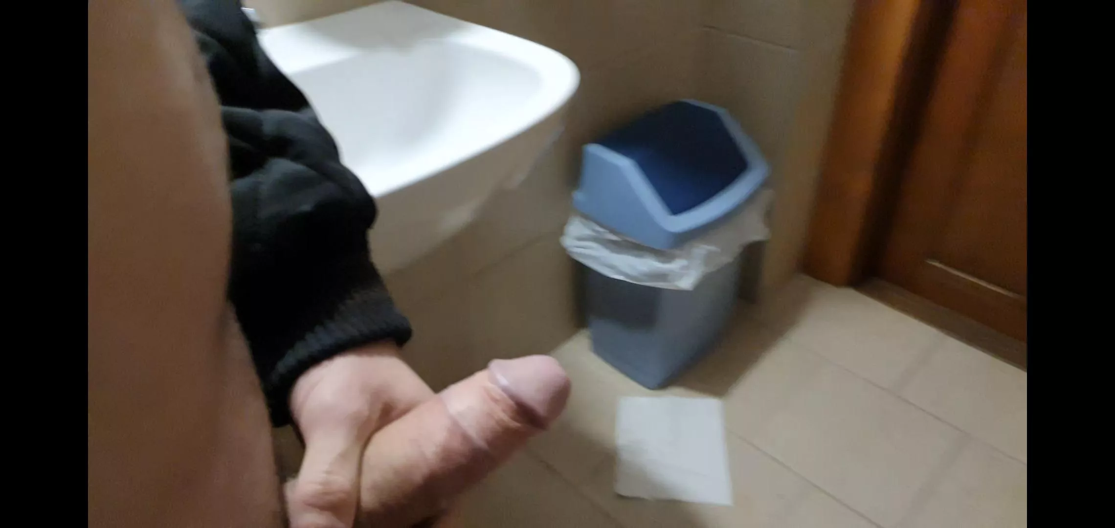 Pants down in a public restroom