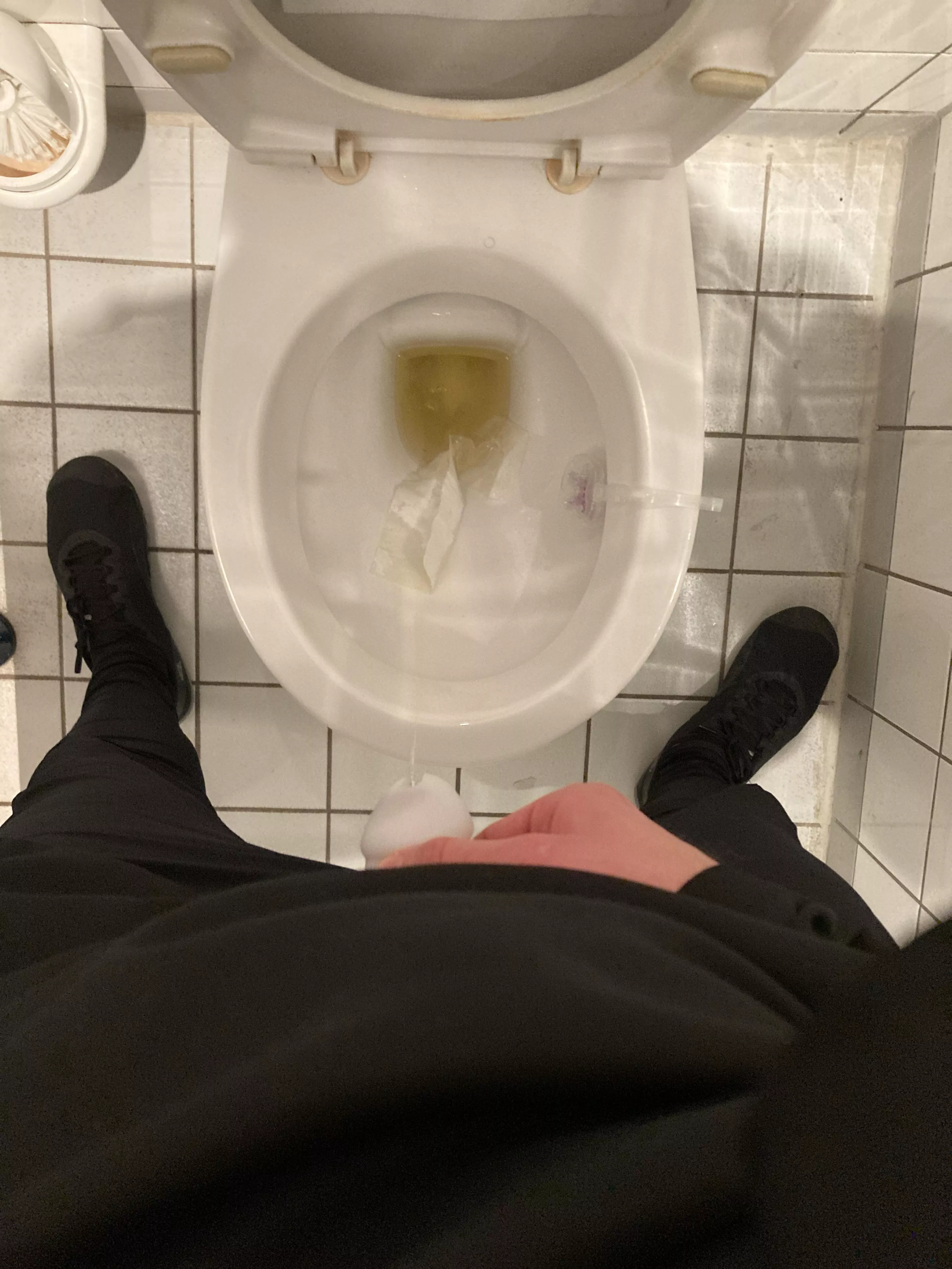 Pissing while wearing a cage