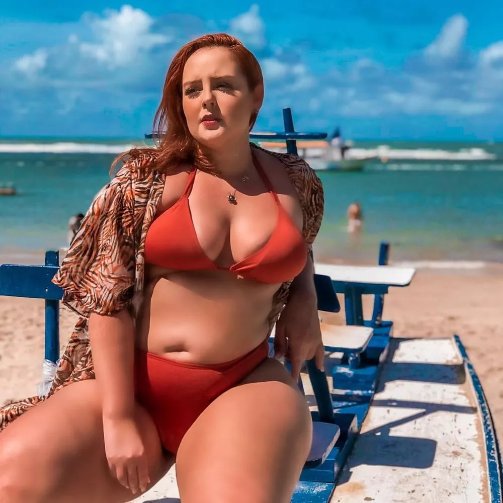 Plump tan redhead on the beach