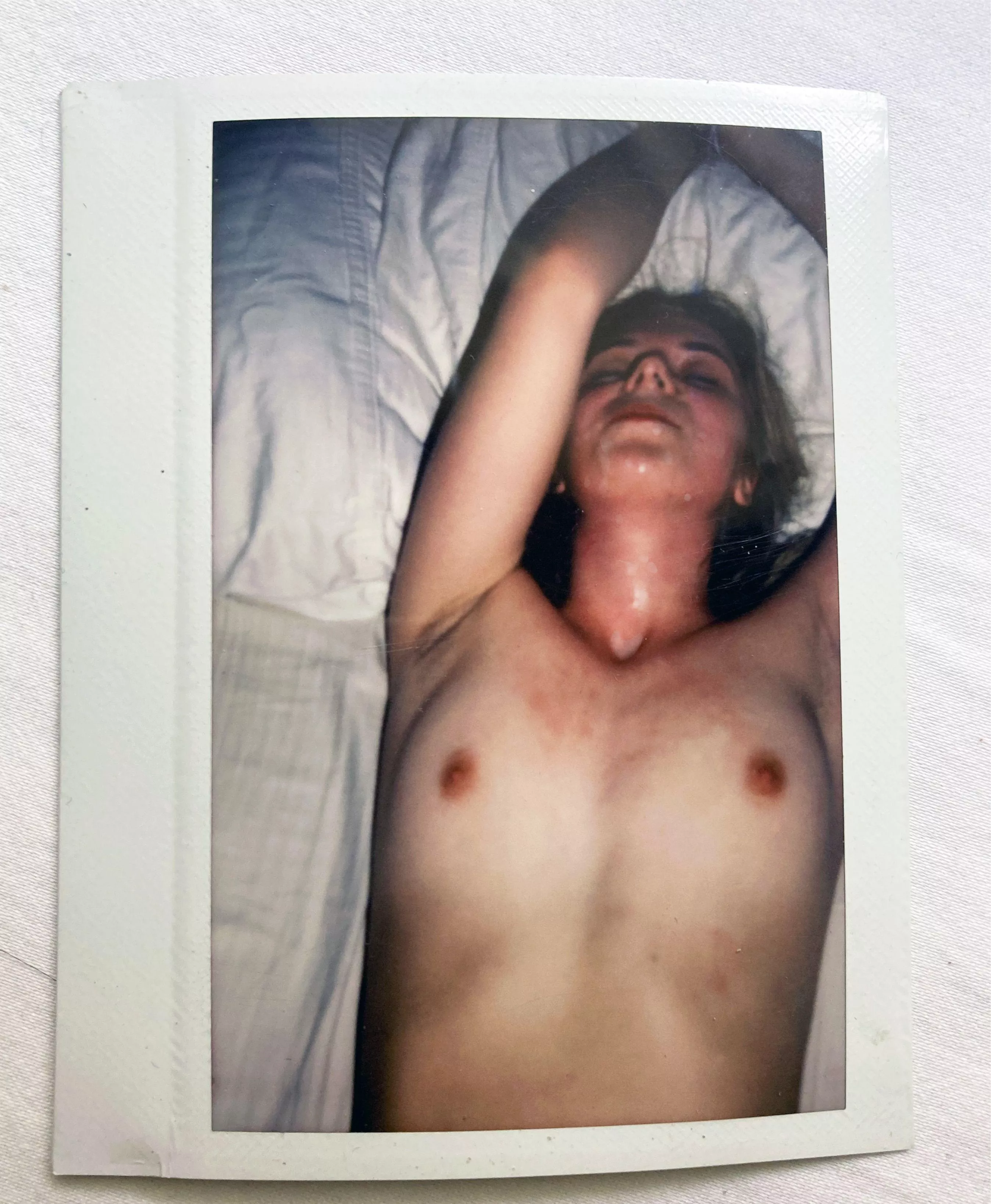 Polaroid of her face covered in cum..