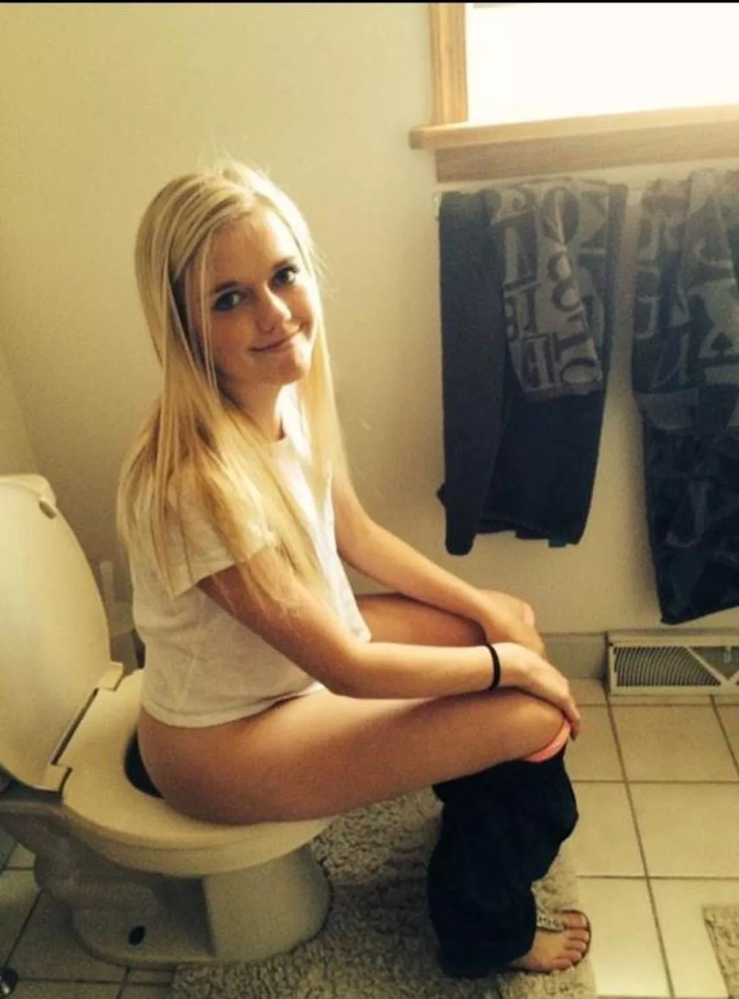 Potty blonde with pink panties.