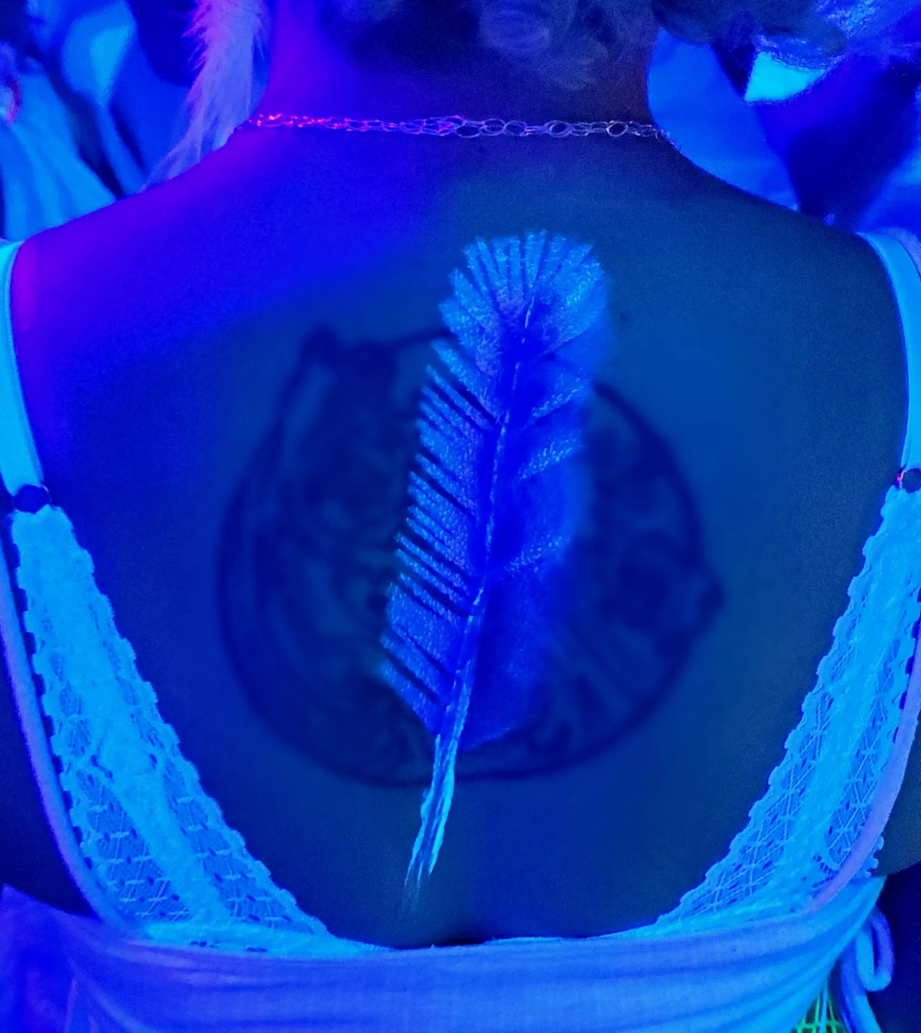 Proud of a blacklight reactive feather I painted at a rave last weekend 😊