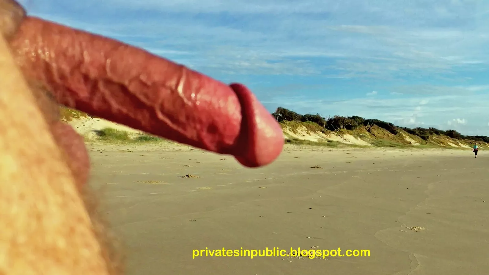 Public erection on the beach. You can see someone's coming soon..