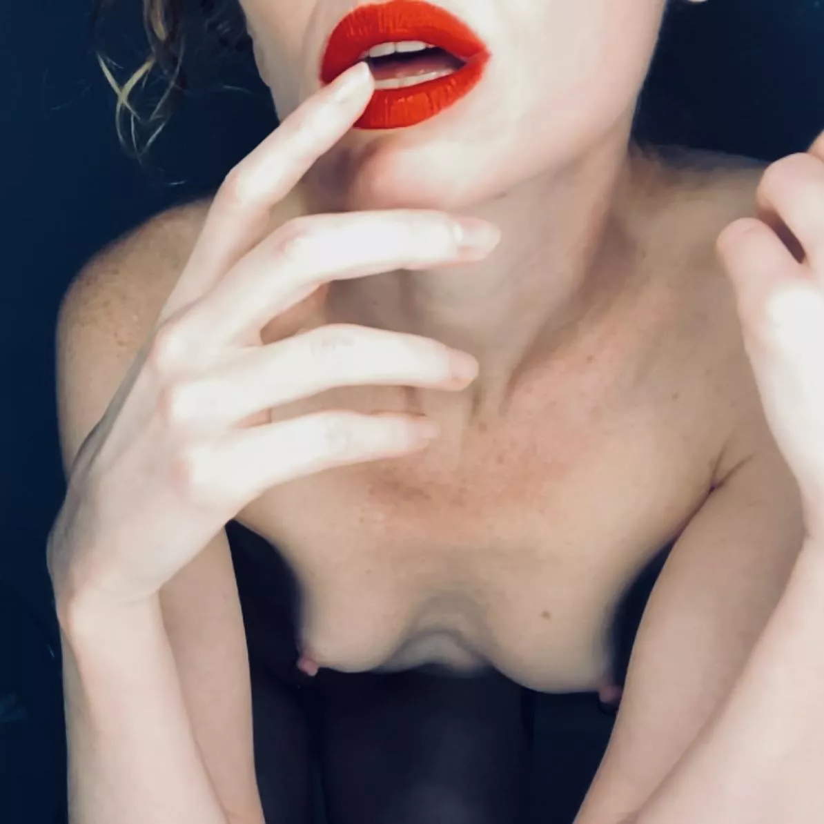 Red lips and long fingers